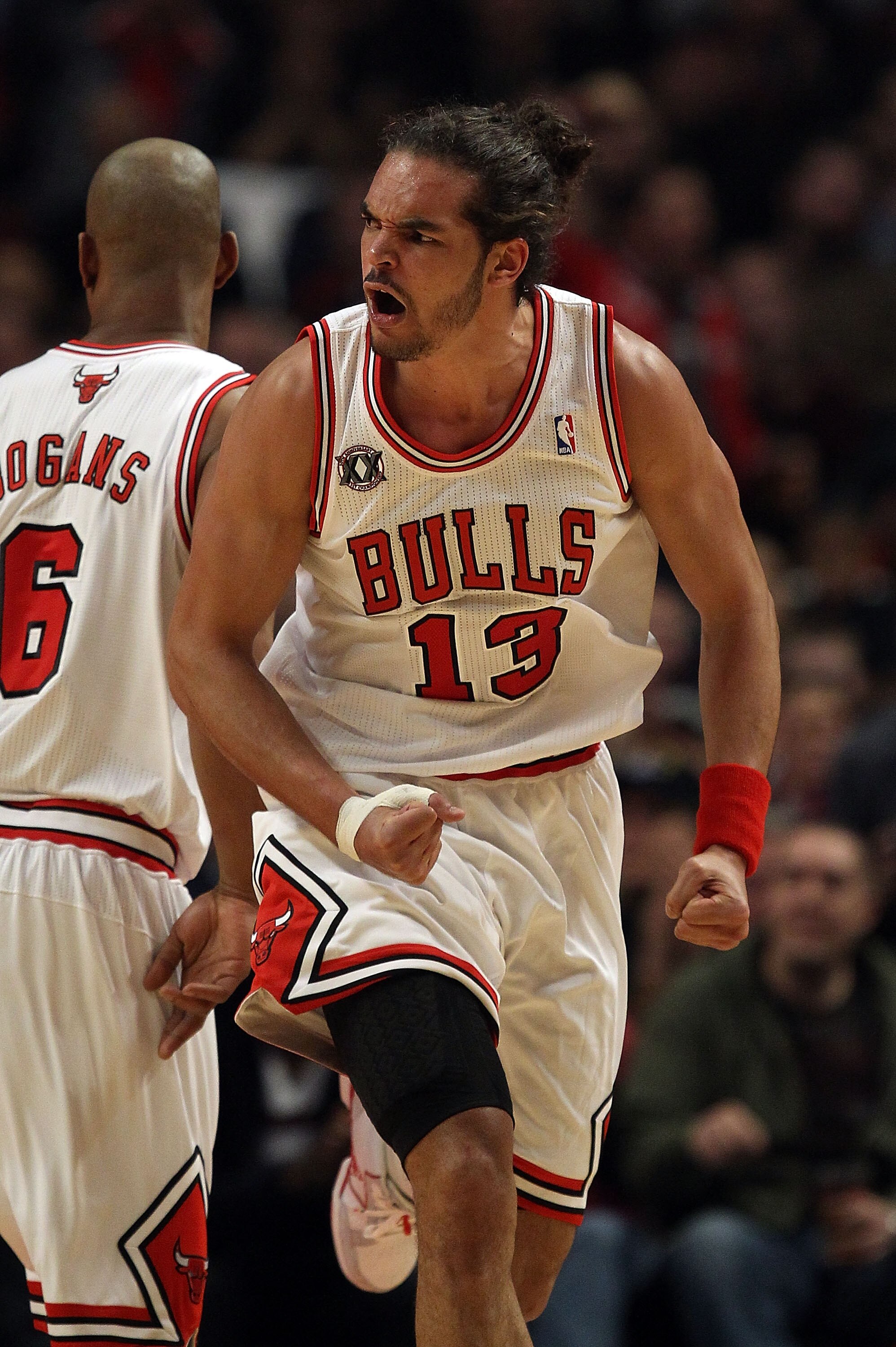 CHICAGO, IL - FEBRUARY 24: Joakim Noah #13 of the Chicago Bulls celebrates a dunk against the Miami Heat at the United Center on February 24, 2011 in Chicago, Illinois. The Bulls defeated the Heat 93-89. NOTE TO USER: User expressly acknowledges and agree