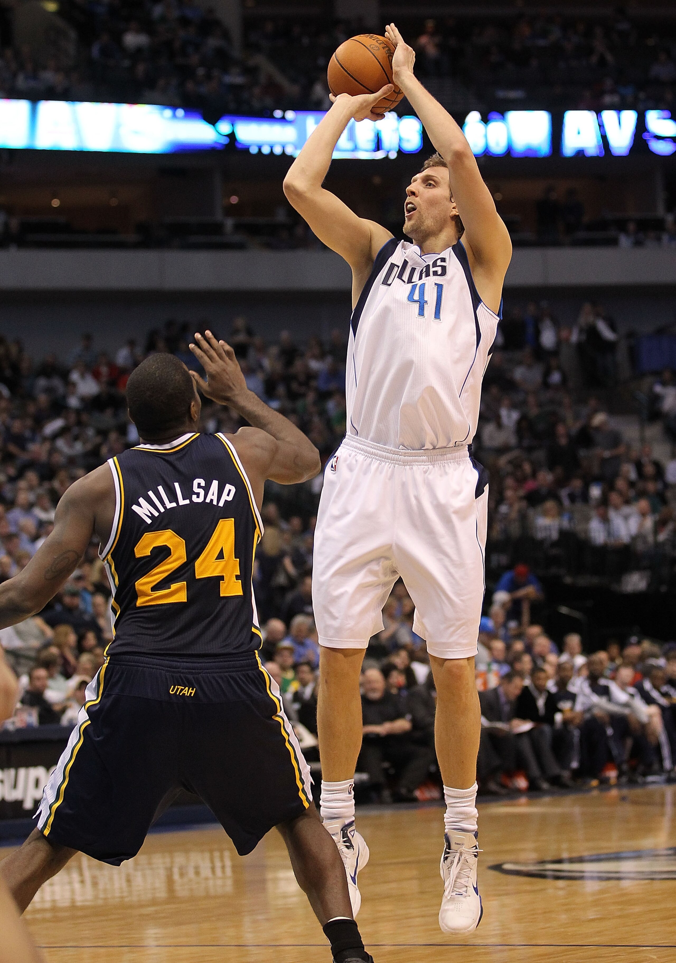 DALLAS, TX - FEBRUARY 23: Forward Dirk Nowitzki #41 of the Dallas Mavericks takes a shot against Paul Millsap #24 of the Utah Jazz at American Airlines Center on February 23, 2011 in Dallas, Texas. NOTE TO USER: User expressly acknowledges and agrees th DALLAS, TX - FEBRUARY 23: Forward Dirk Nowitzki #41 of the Dallas Mavericks takes a shot against Paul Millsap #24 of the Utah Jazz at American Airlines Center on February 23, 2011 in Dallas, Texas. NOTE TO USER: User expressly acknowledges and agrees th
