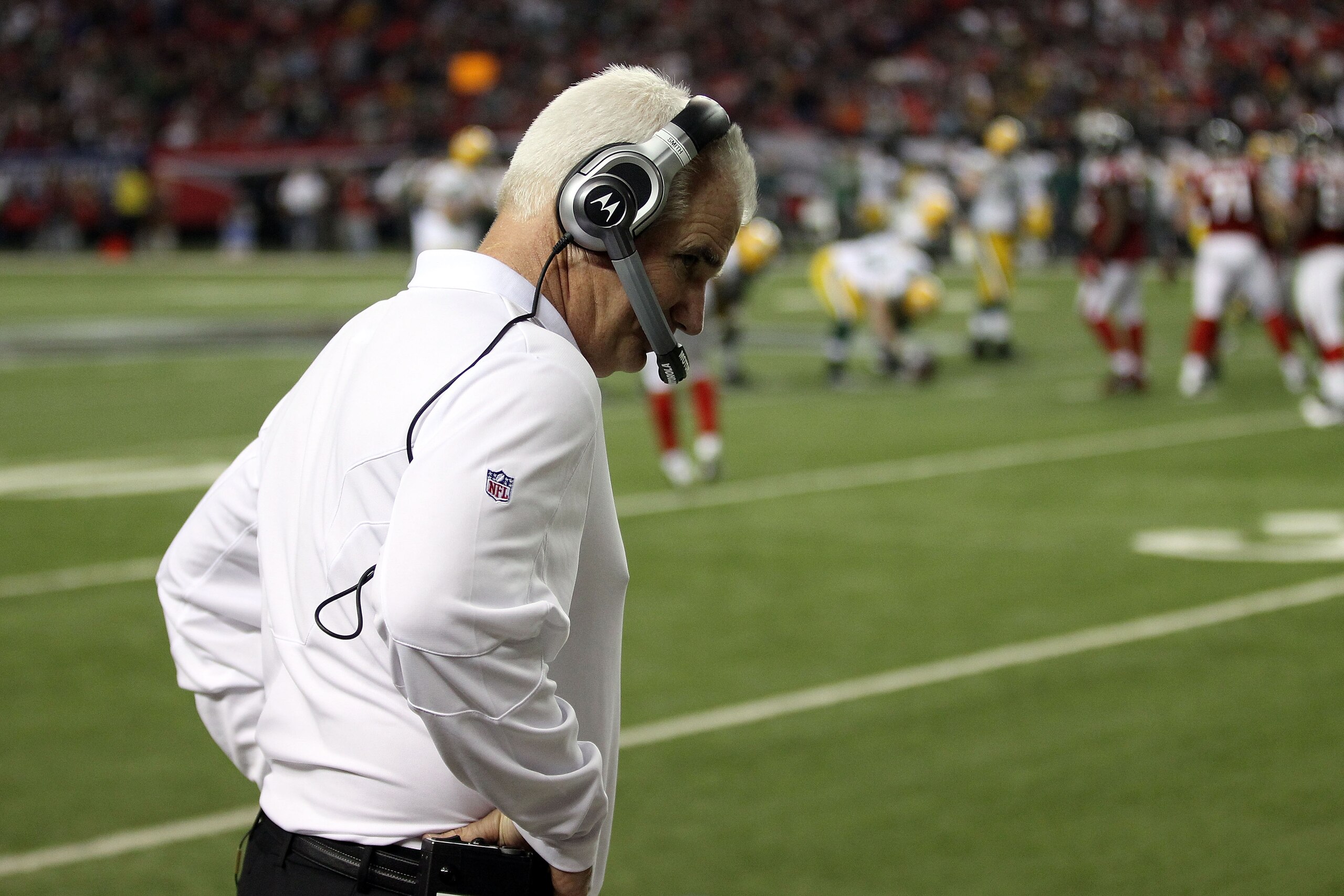 ATLANTA, GA - JANUARY 15:  Head coach Mike Smith of the Atlanta Falcons hangs his head on the sideline against the Green Bay Packers during their 2011 NFC divisional playoff game at Georgia Dome on January 15, 2011 in Atlanta, Georgia. The Packers won 48-