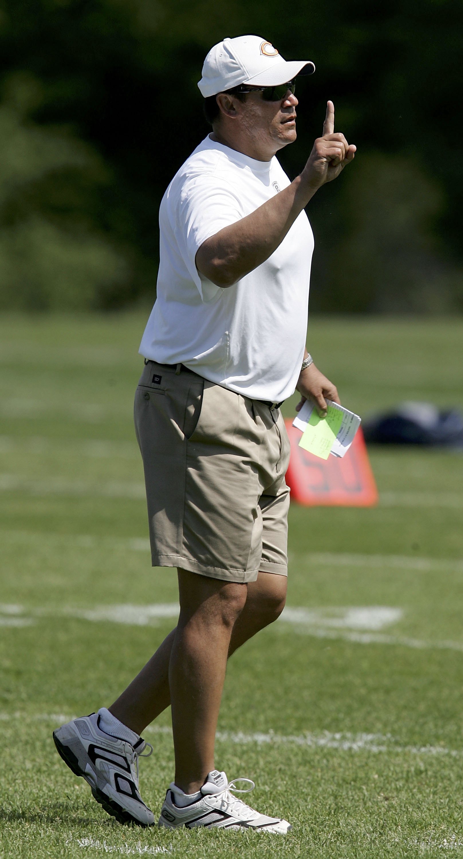 LAKE FOREST, IL - JUNE 2:  Defensive coordinator Ron Rivera of the Chicago Bears signals to his team during a mini-camp practice on June 2, 2006 at Halas Hall in Lake Forest, Illinois.  (Photo by Jonathan Daniel/Getty Images)