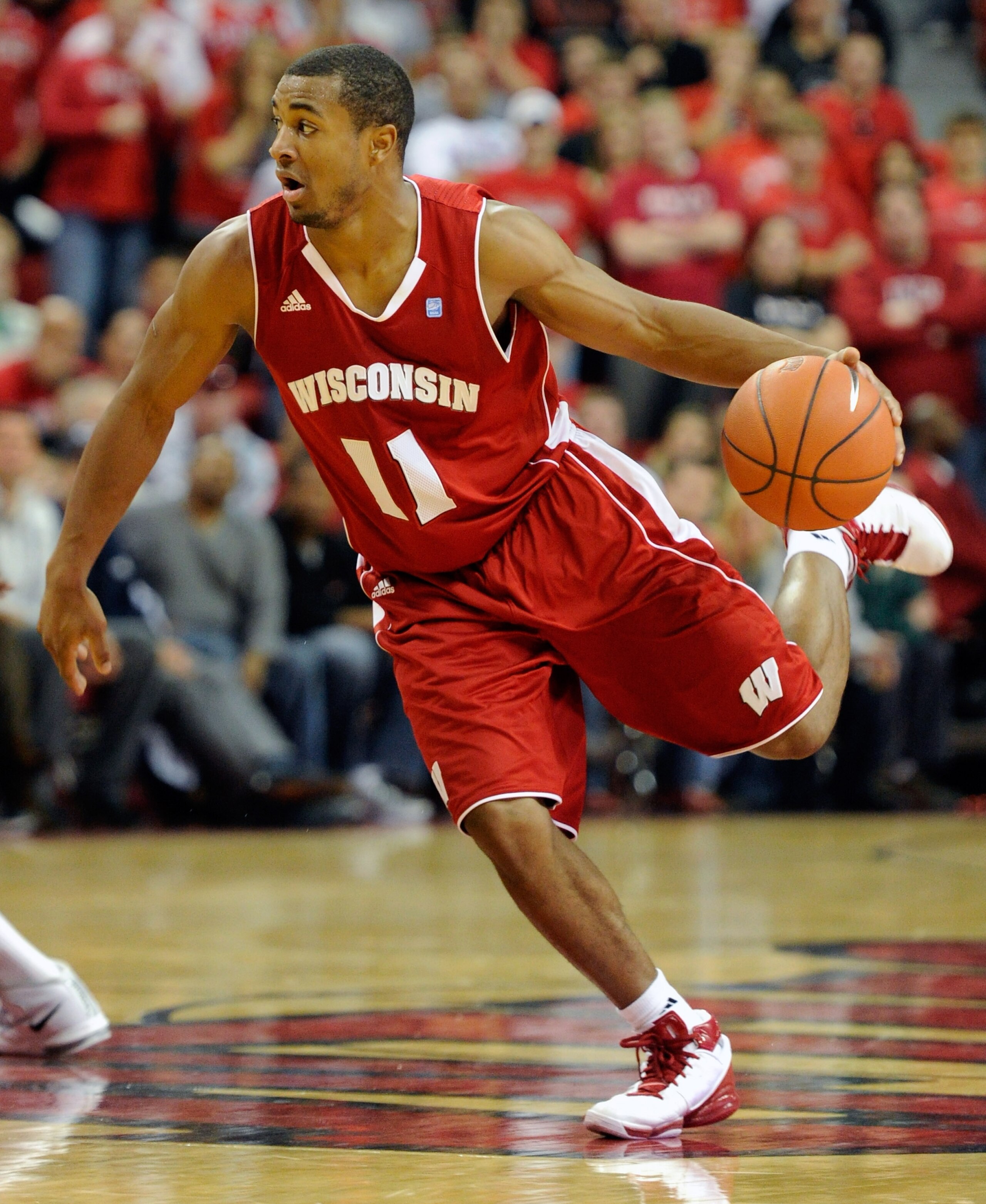 LAS VEGAS - NOVEMBER 20: Jordan Taylor #11 of the Wisconsin Badgers brings the ball up the court against the UNLV Rebels during their game at the Thomas & Mack Center November 20, 2010 in Las Vegas, Nevada. UNLV won 68-65. (Photo by Ethan Miller/Getty I LAS VEGAS - NOVEMBER 20: Jordan Taylor #11 of the Wisconsin Badgers brings the ball up the court against the UNLV Rebels during their game at the Thomas & Mack Center November 20, 2010 in Las Vegas, Nevada. UNLV won 68-65. (Photo by Ethan Miller/Getty I