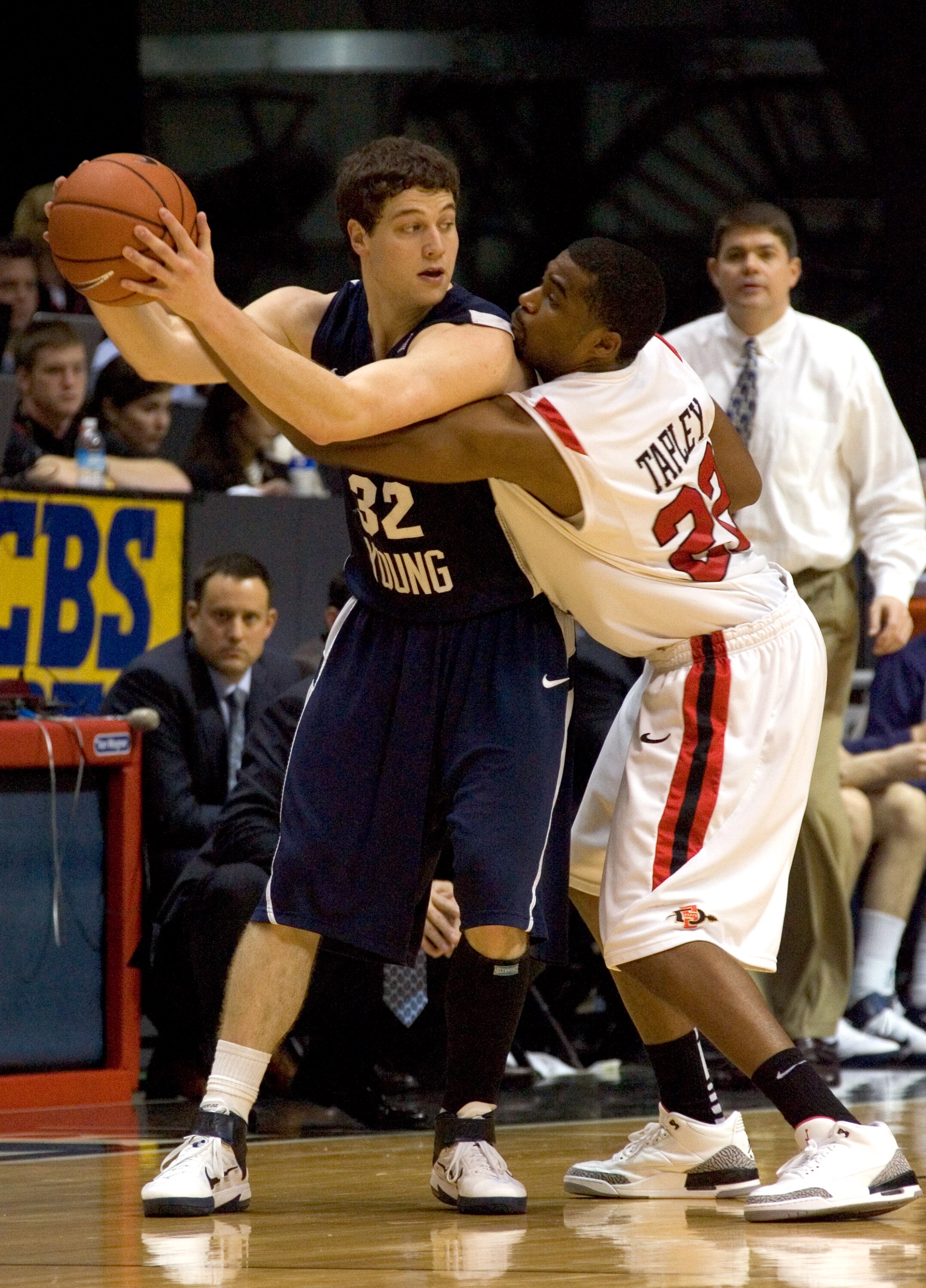 SAN DIEGO, CA - FEBRUARY 26:  Jimmer Fredette #32 of the Brigham Young Cougars looks to pass the ball against Chase Tapley #22 of the San Diego State Aztecs during the second half at Cox Arena on February 26, 2011 in San Diego, California. BYU beat SDSU 8