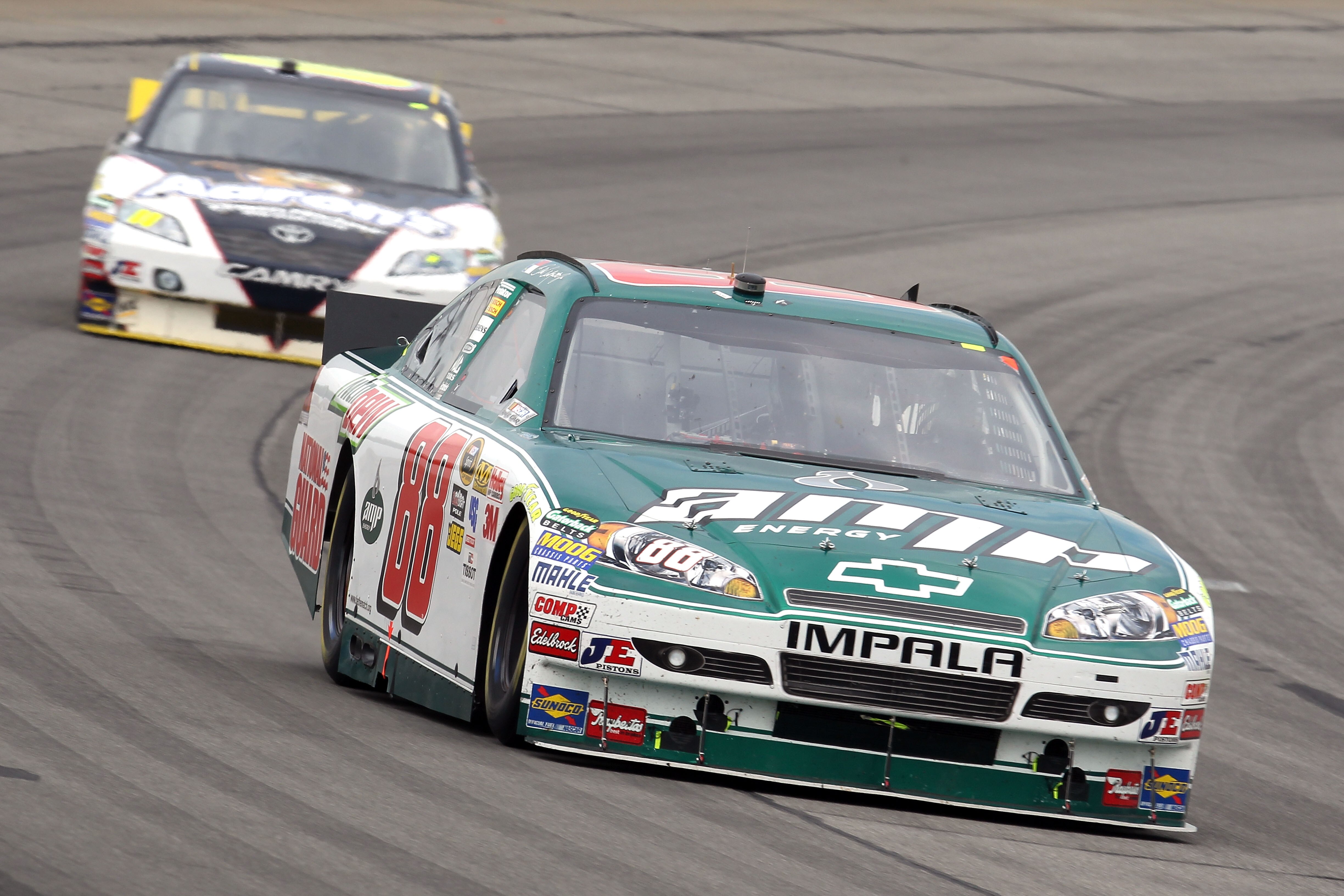 LONG POND, PA - AUGUST 01:  Dale Earnhardt Jr., driver of the #88 AMP Energy/National Guard Chevrolet, leads David Reutimann, driver of the #00 Aaron's Dream Machine Toyota,  during the NASCAR Sprint Cup Series Sunoco Red Cross Pennsylvania 500 at Pocono
