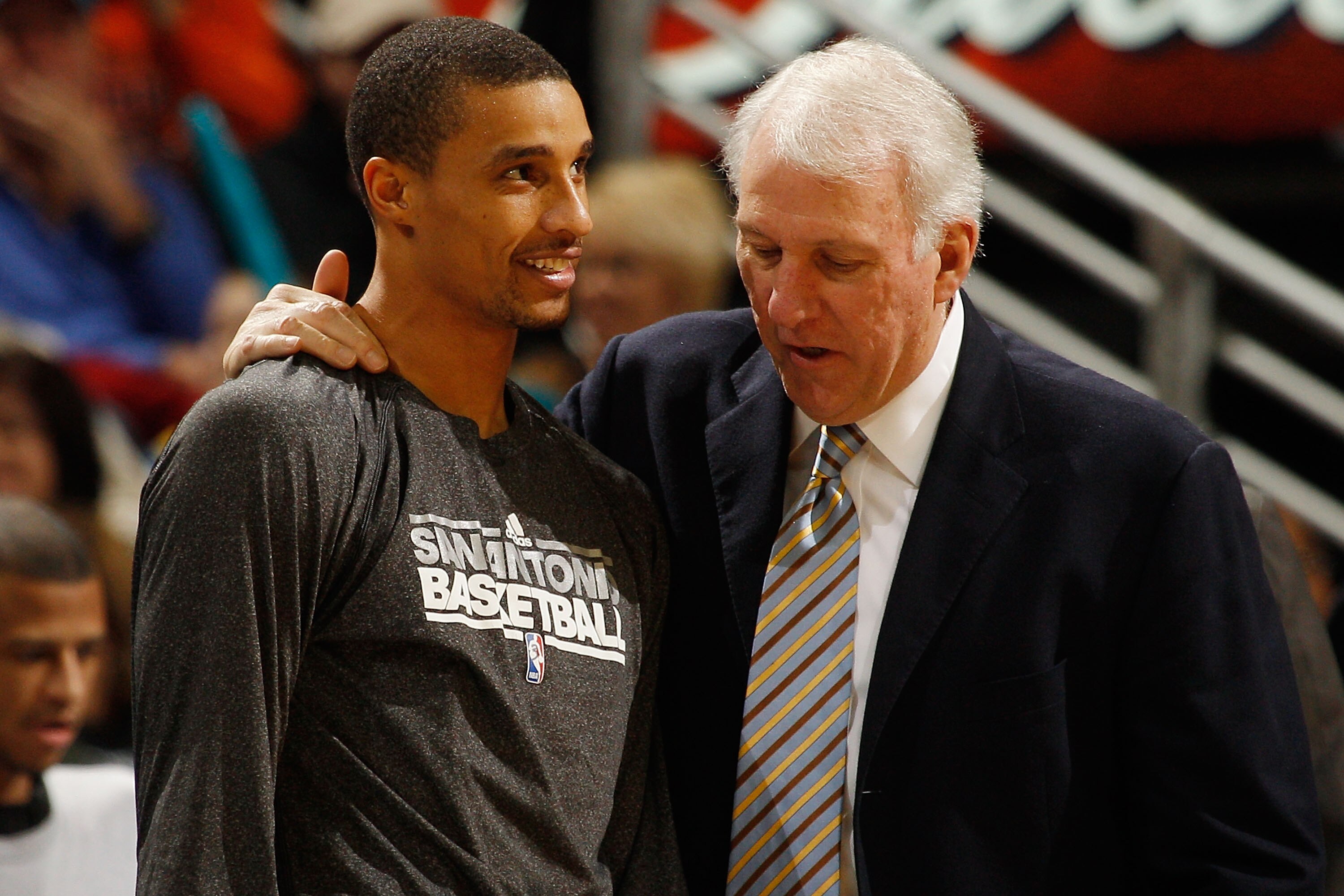 NEW ORLEANS, LA - JANUARY 22:  Head coach Greg Popovich talks with George Hill #3 of the San Antonio Spurs during the game against the New Orleans Hornets at the New Orleans Arena on January 22, 2011 in New Orleans, Louisiana.  NOTE TO USER: User expressl