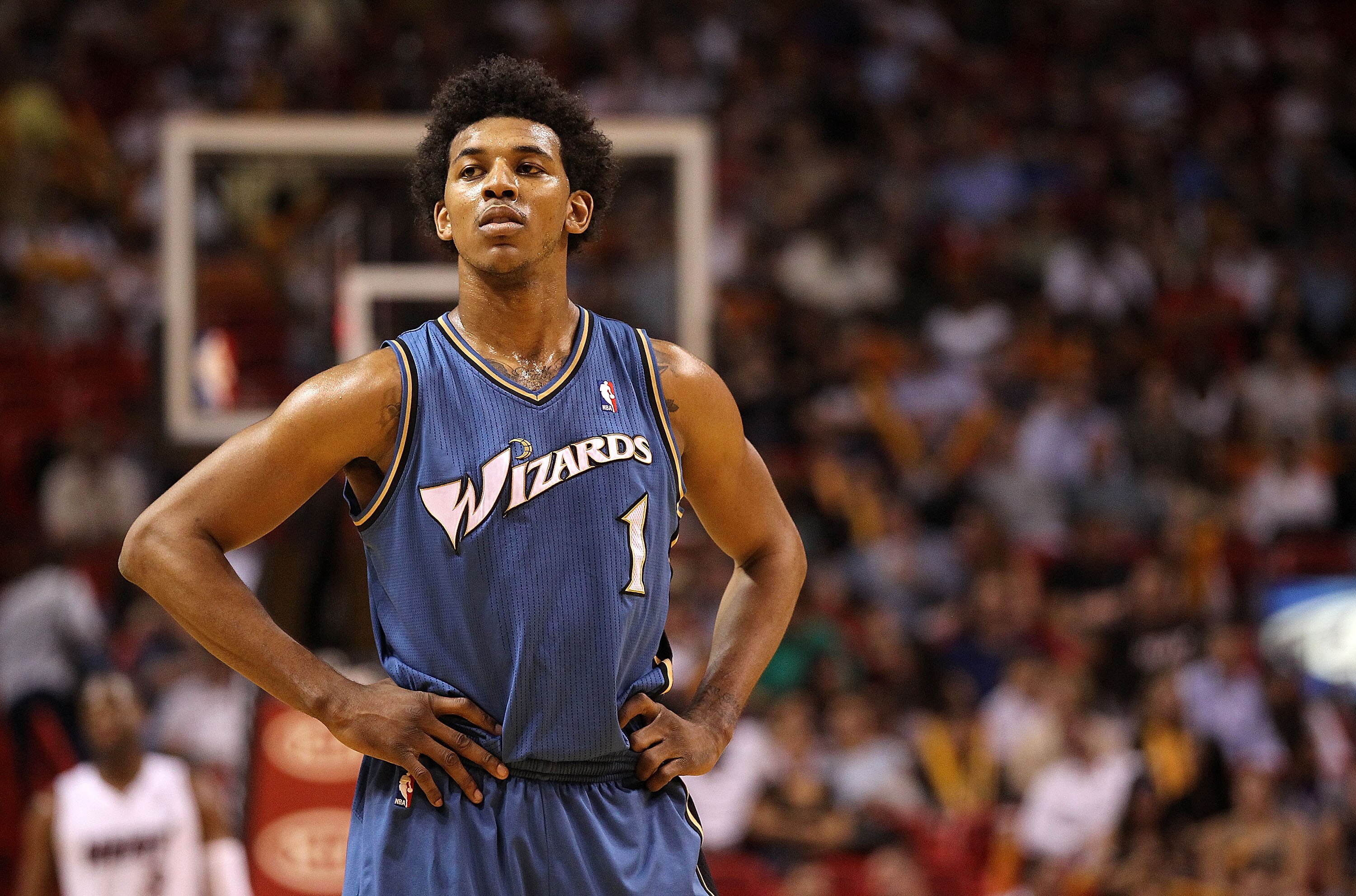 MIAMI, FL - FEBRUARY 25:  Nick Young #1 of the  Washington Wizards looks on during a pause in the game against the Miami Heat  at American Airlines Arena on February 25, 2011 in Miami, Florida. NOTE TO USER: User expressly acknowledges and agrees that, by
