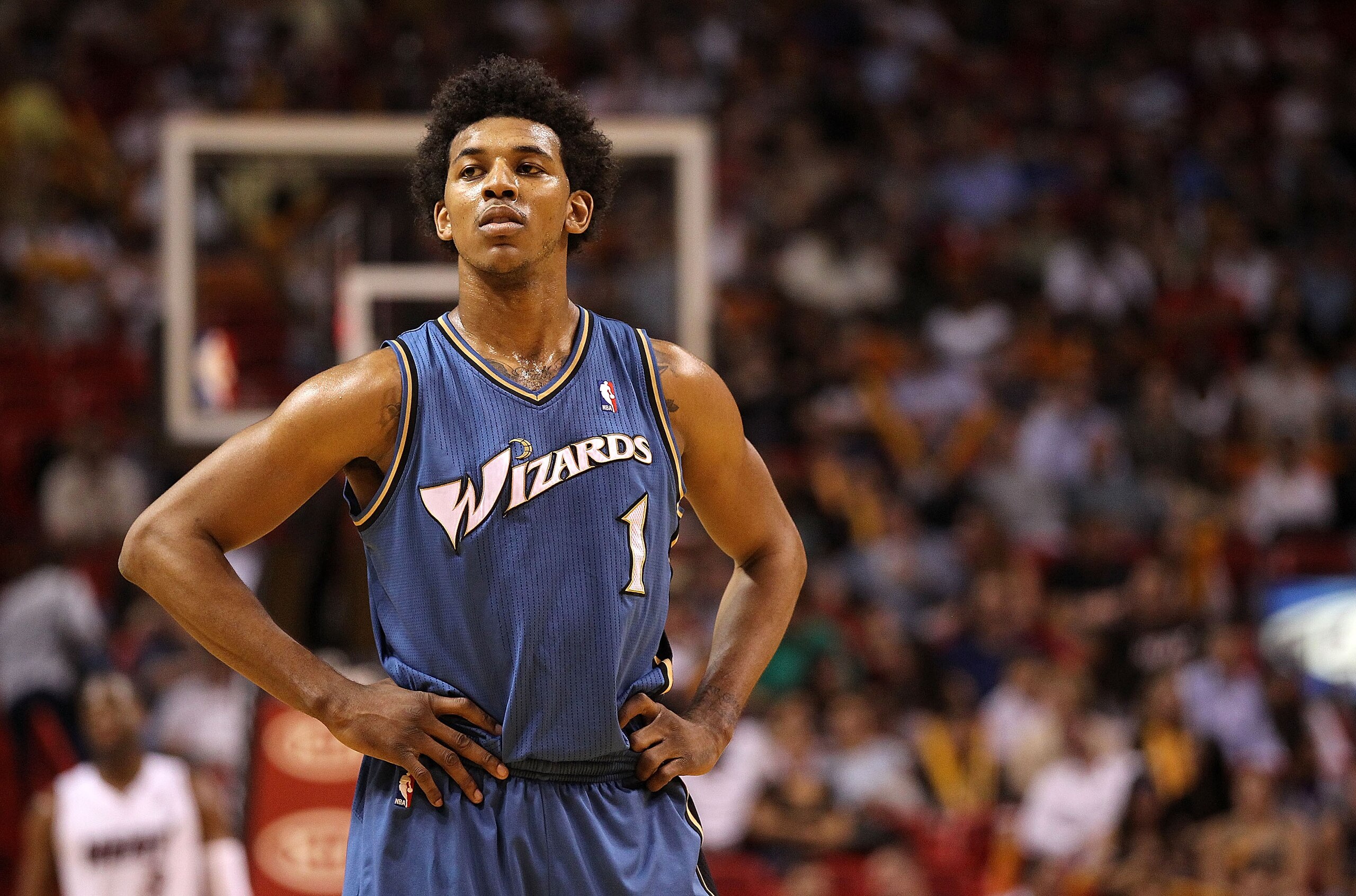 MIAMI, FL - FEBRUARY 25:  Nick Young #1 of the  Washington Wizards looks on during a pause in the game against the Miami Heat  at American Airlines Arena on February 25, 2011 in Miami, Florida. NOTE TO USER: User expressly acknowledges and agrees that, by