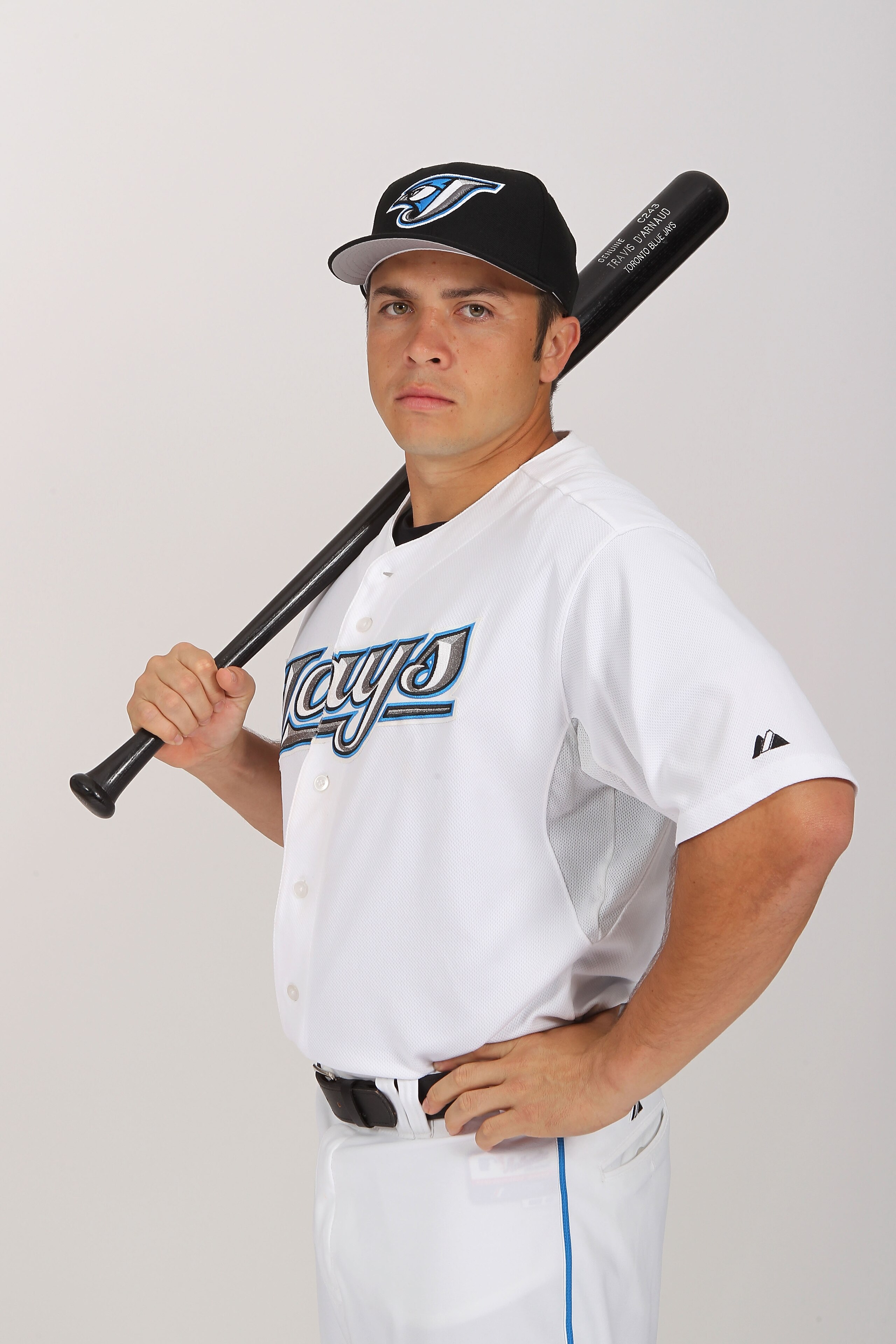 DUNEDIN, FL - FEBRUARY 20: Travis d'Arnaud #15 of the Toronto Blue Jays poses during photo day at Florida Auto Exchange Stadium on February 20, 2011 in Dunedin, Florida. (Photo by Nick Laham/Getty Images) DUNEDIN, FL - FEBRUARY 20: Travis d'Arnaud #15 of the Toronto Blue Jays poses during photo day at Florida Auto Exchange Stadium on February 20, 2011 in Dunedin, Florida. (Photo by Nick Laham/Getty Images)