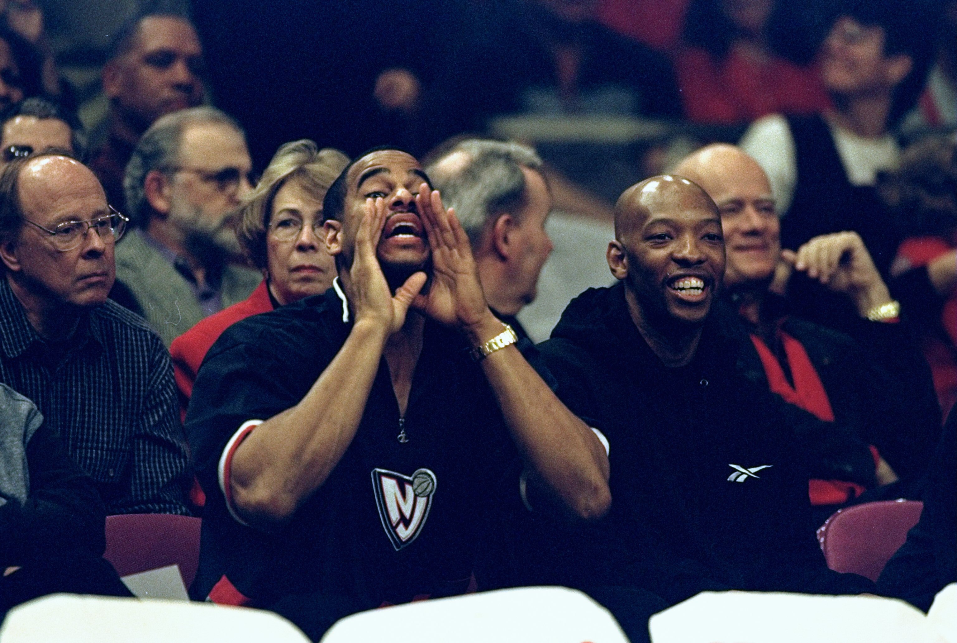 24 Jan 1999: Jayson Williams #55 and Sam Cassell #10 of the New Jersey Nets cheer on of the St John''s Red Storm during the game against the Duke Blue Devils at the Madison Square Garden in New York, New York. The Blue Devils defeated the Red Storm 92-88.