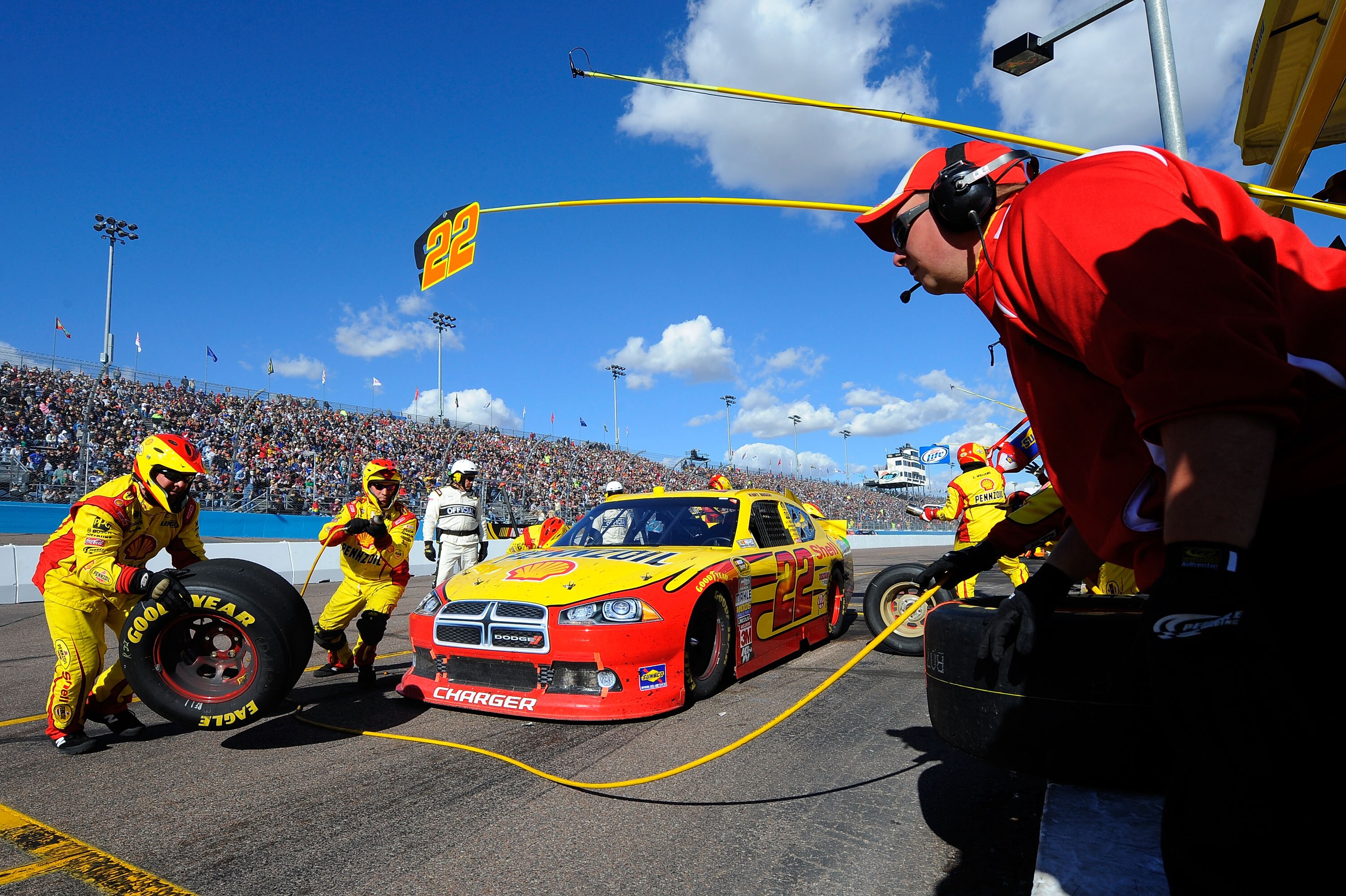 AVONDALE, AZ - FEBRUARY 27:  Kurt Busch, driver of the #22 Shell/Pennzoil Dodge, makes a pit stop during the NASCAR Sprint Cup Series Subway Fresh Fit 500 at Phoenix International Raceway on February 27, 2011 in Avondale, Arizona.  (Photo by Jared C. Tilt