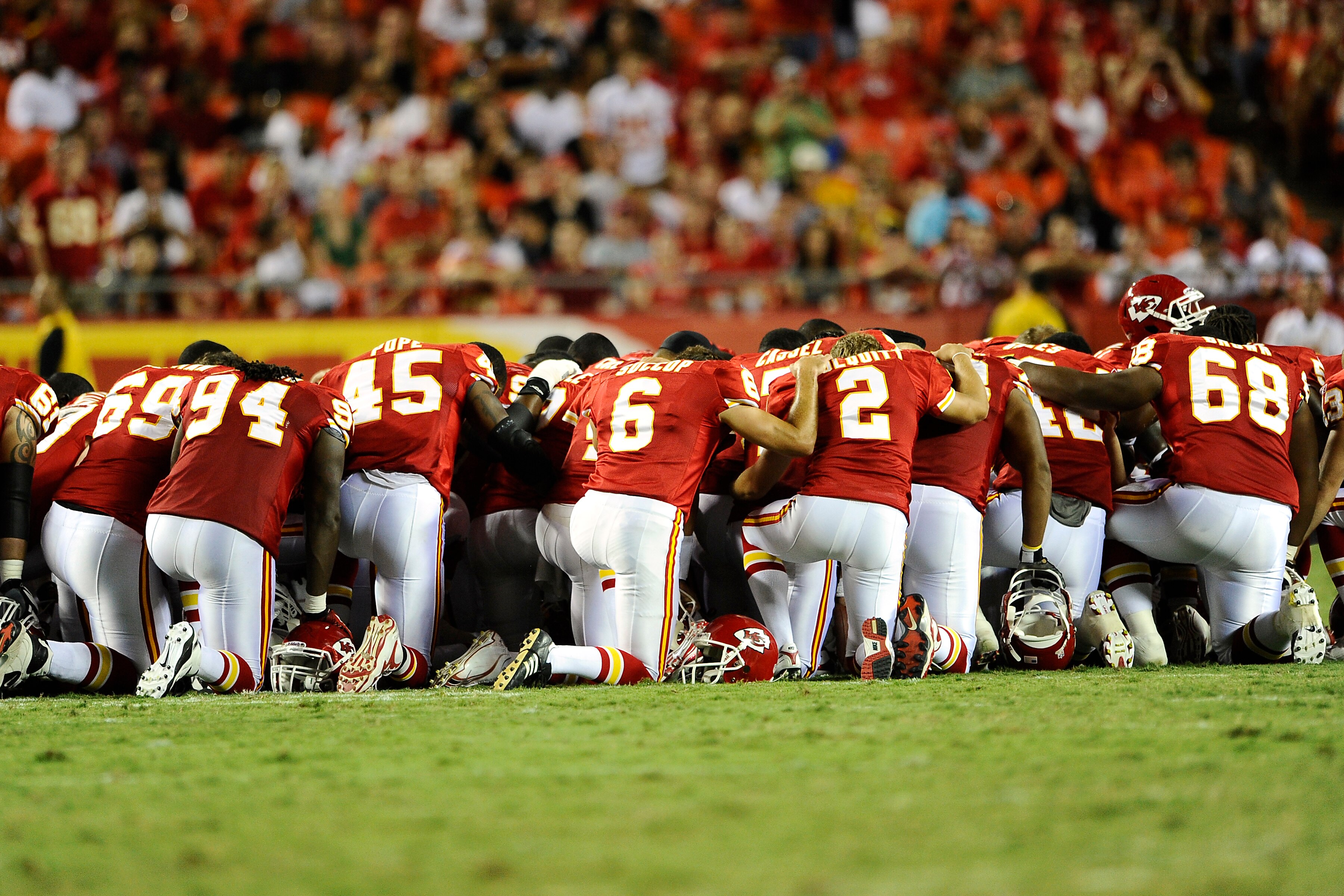 KANSAS CITY, MO - AUGUST 27: Players for the Kansas City Chiefs gather on the field to pray for Cameron Sheffield who suffered an injury during a preseason game against the Philadelphia Eagles at Arrowhead Stadium on August 27, 2010 in Kansas City, Missou