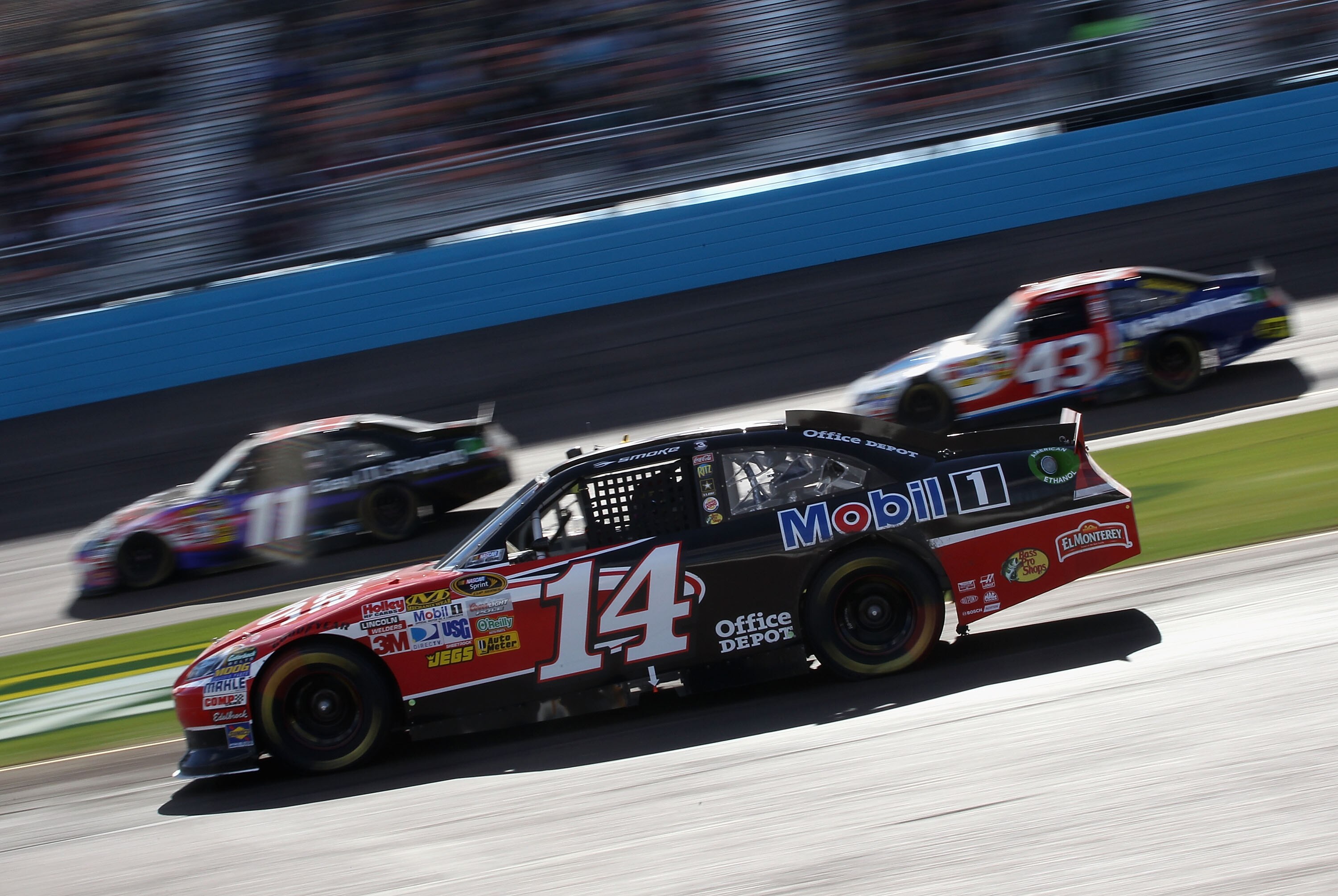 AVONDALE, AZ - FEBRUARY 27:  Tony Stewart, driver of the #14 Mobil 1/Office Depot Chevrolet, drives on pit road during the NASCAR Sprint Cup Series Subway Fresh Fit 500 at Phoenix International Raceway on February 27, 2011 in Avondale, Arizona.  (Photo by