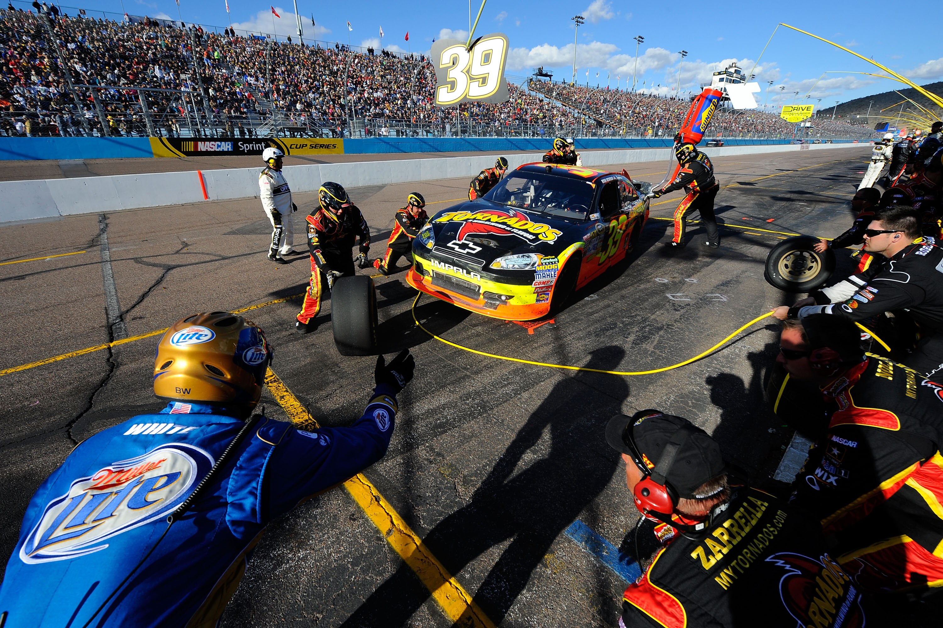 AVONDALE, AZ - FEBRUARY 27:  Ryan Newman, driver of the #39 Tornados Chevrolet, makes a pit stop during the NASCAR Sprint Cup Series Subway Fresh Fit 500 at Phoenix International Raceway on February 27, 2011 in Avondale, Arizona.  (Photo by Jared C. Tilto