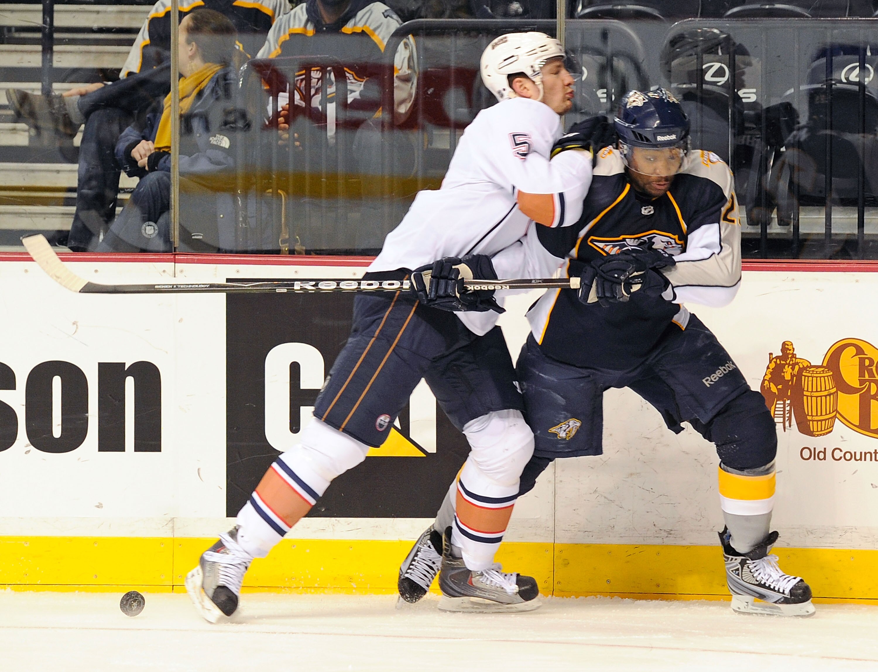 NASHVILLE, TN - FEBRUARY 07:  Joel Ward #29 of the Nashville Predators is checked by Ladislav Smid #5 of the Edmonton Oilers on February 7, 2011 at the Bridgestone Arena in Nashville, Tennessee.  (Photo by Frederick Breedon/Getty Images)