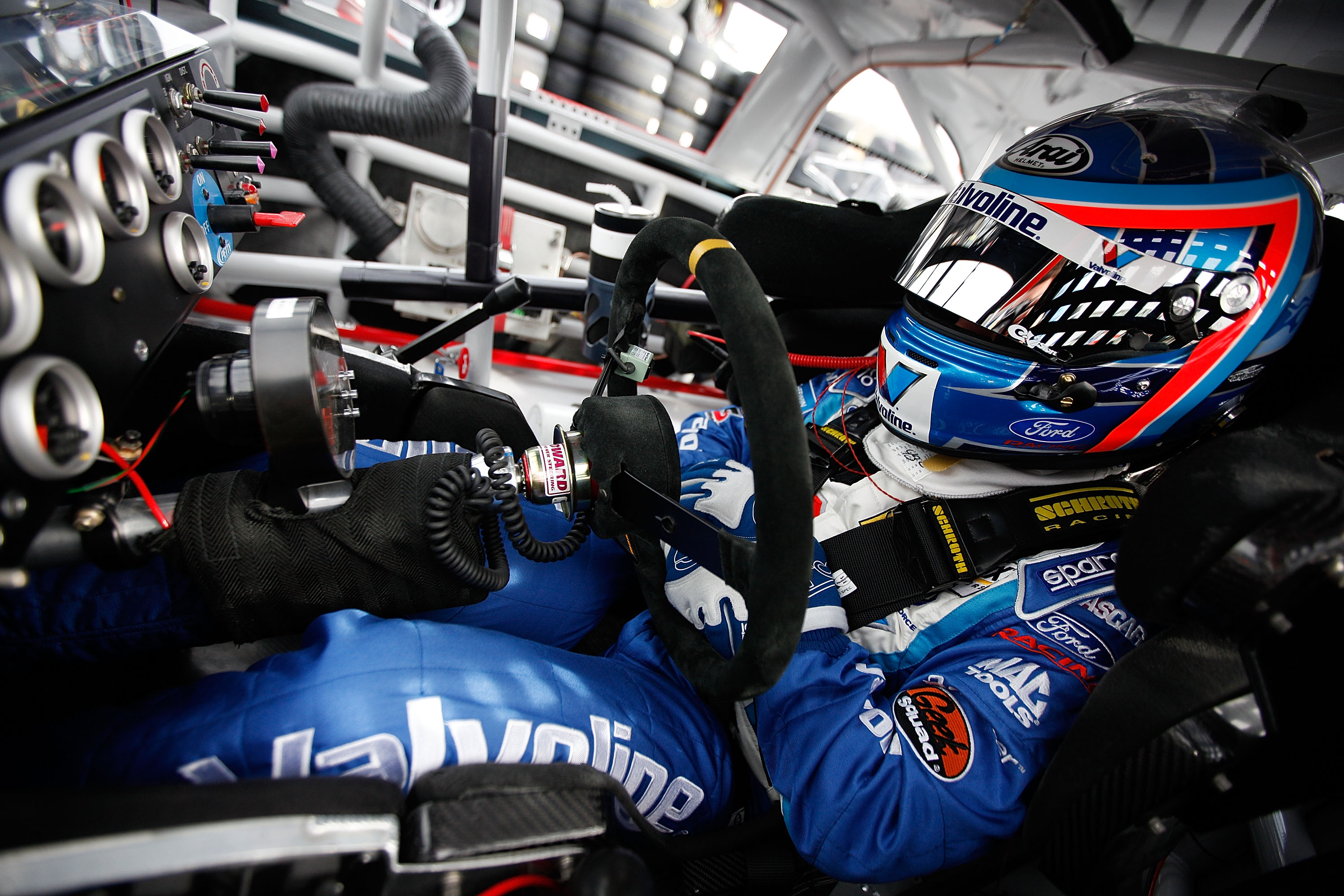 AVONDALE, AZ - FEBRUARY 25:  A.J. Allmendinger, driver of the #43 Valvoline Ford, sits in his car during practice for the Subway Fresh Fit 500 at Phoenix International Raceway on February 25, 2011 in Avondale, Arizona.  (Photo by Chris Graythen/Getty Imag