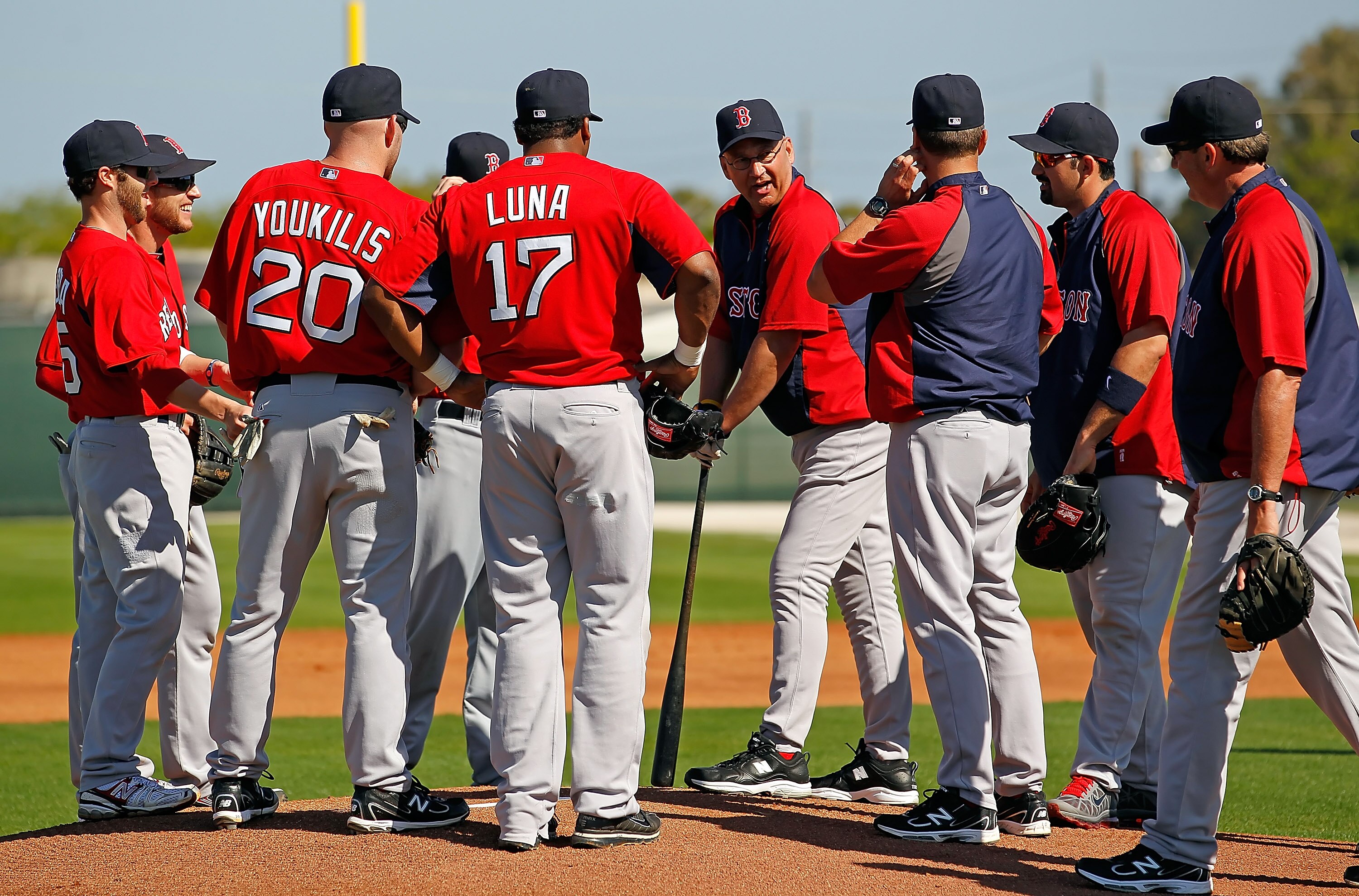 FORT MYERS, FL - FEBRUARY 19:  Manager Terry Francona #47 (leaning on a bat) of the Boston Red Sox talks with the infield during a Spring Training Workout Session at the Red Sox Player Development Complex on February 19, 2011 in Fort Myers, Florida.  (Pho