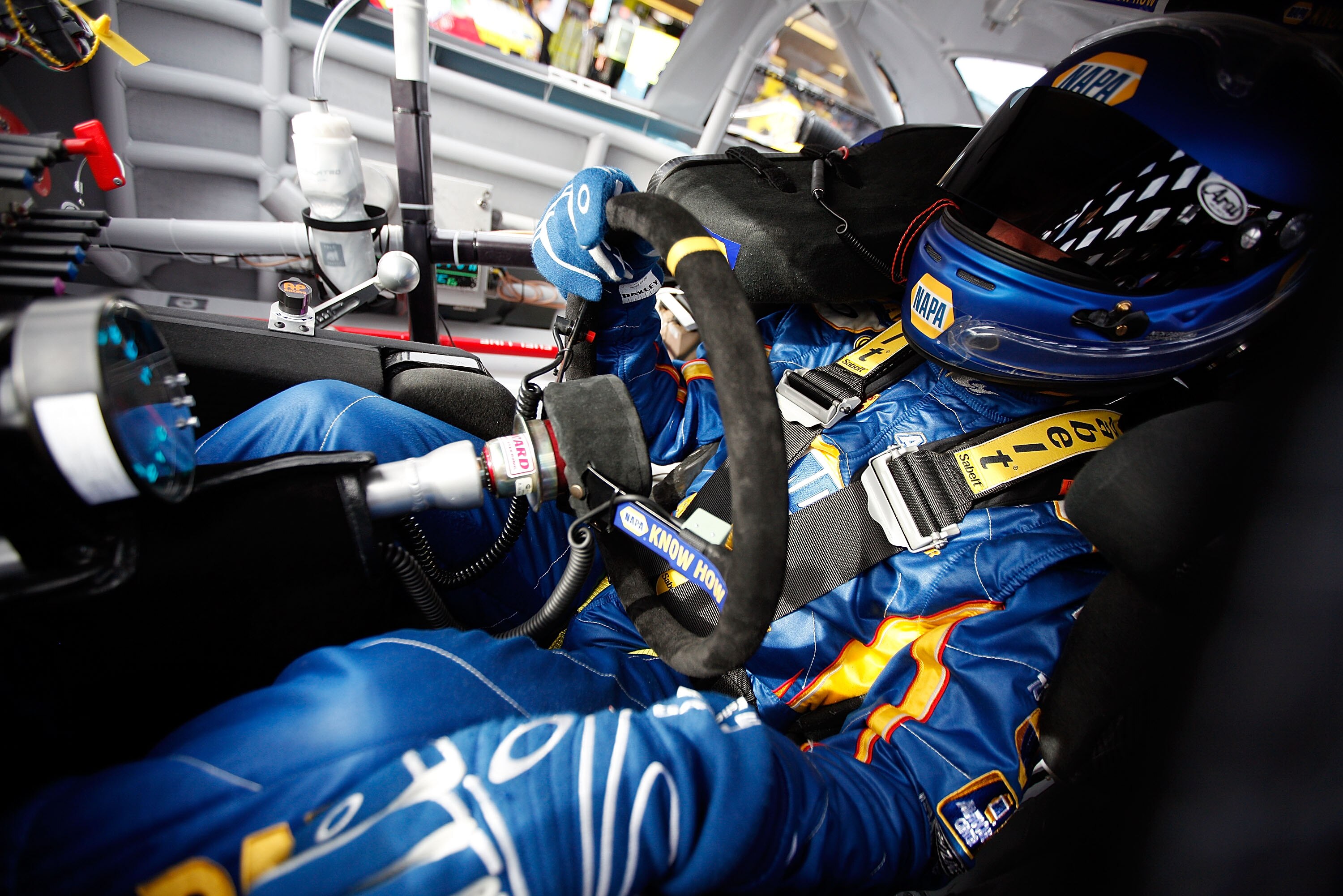 AVONDALE, AZ - FEBRUARY 25:  Martin Truex Jr., driver of the #56 NAPA Toyota, sits in his car during practice for the Subway Fresh Fit 500 at Phoenix International Raceway on February 25, 2011 in Avondale, Arizona.  (Photo by Chris Graythen/Getty Images)