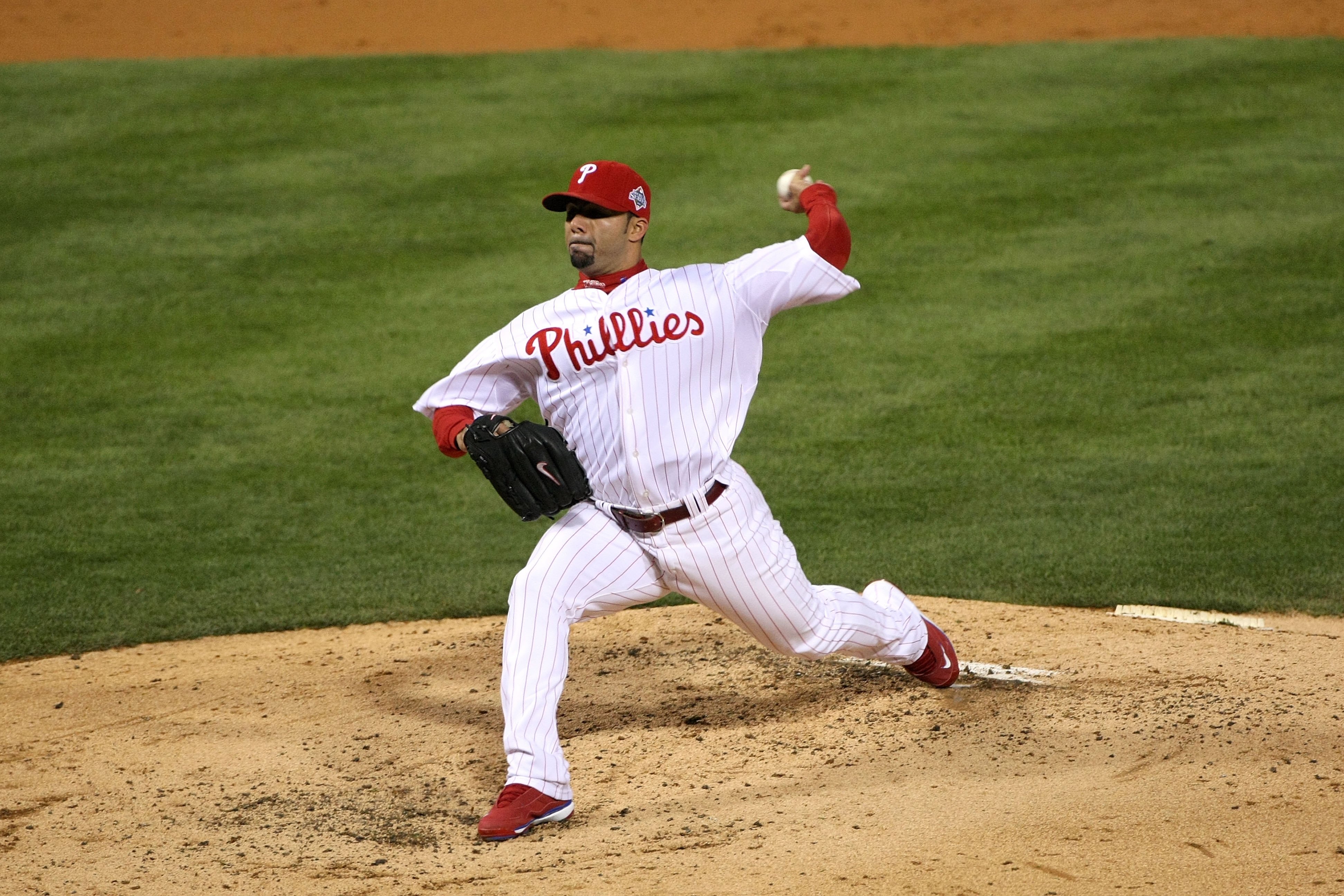 PHILADELPHIA - OCTOBER 29:  J.C. Romero #16 of the Philadelphia Phillies throws a pitch against the Tampa Bay Rays during the continuation of game five of the 2008 MLB World Series on October 29, 2008 at Citizens Bank Park in Philadelphia, Pennsylvania. T
