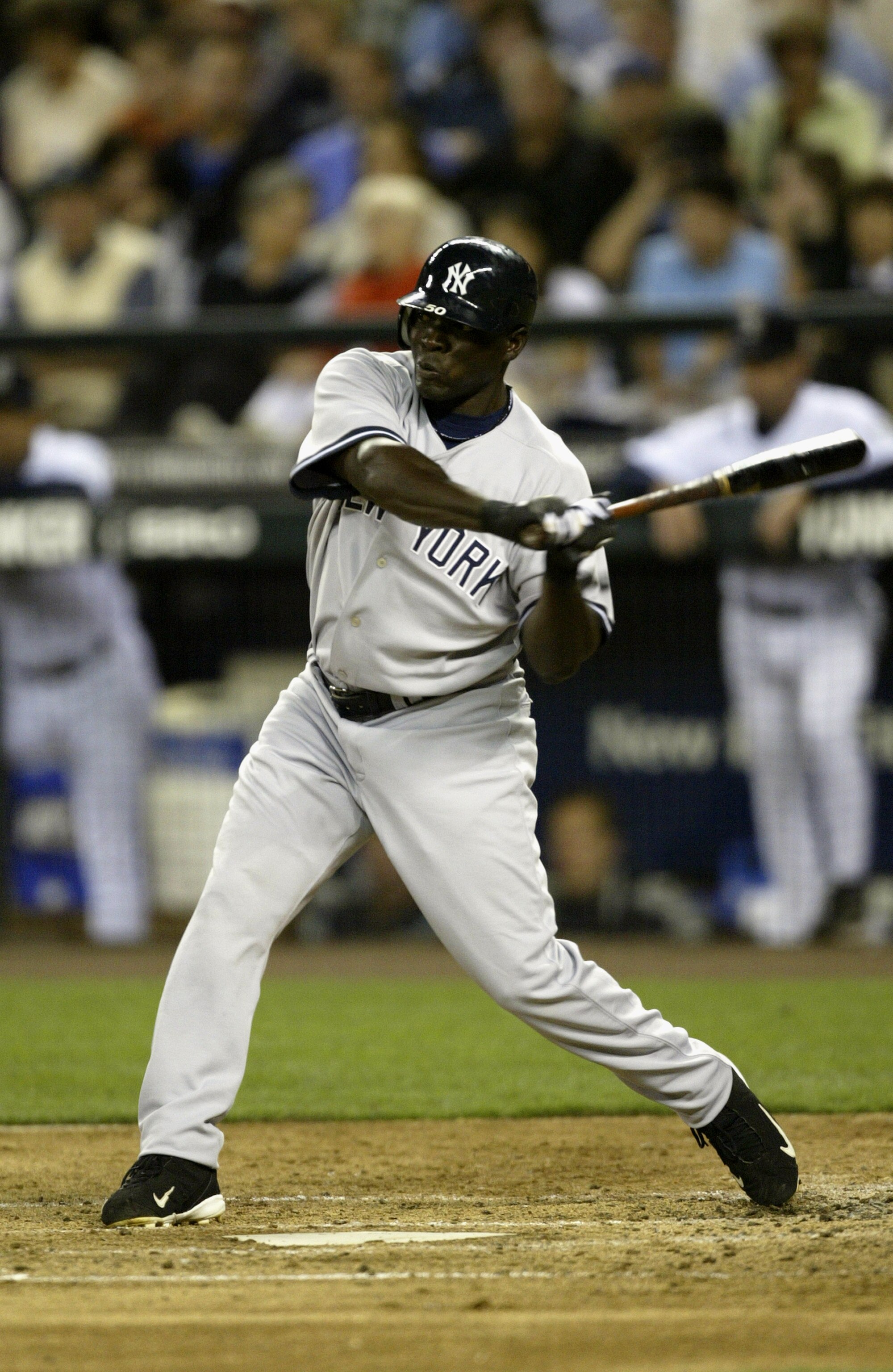 SEATTLE - AUGUST 31:  Outfielder Matt Lawton #50 of the New York Yankees swings at a Seattle Mariners pitch during the game on August 31, 2005 at Safeco Field in Seattle Washington. The Yankees won 2-0.  (Photo by Otto Greule Jr/Getty Images)