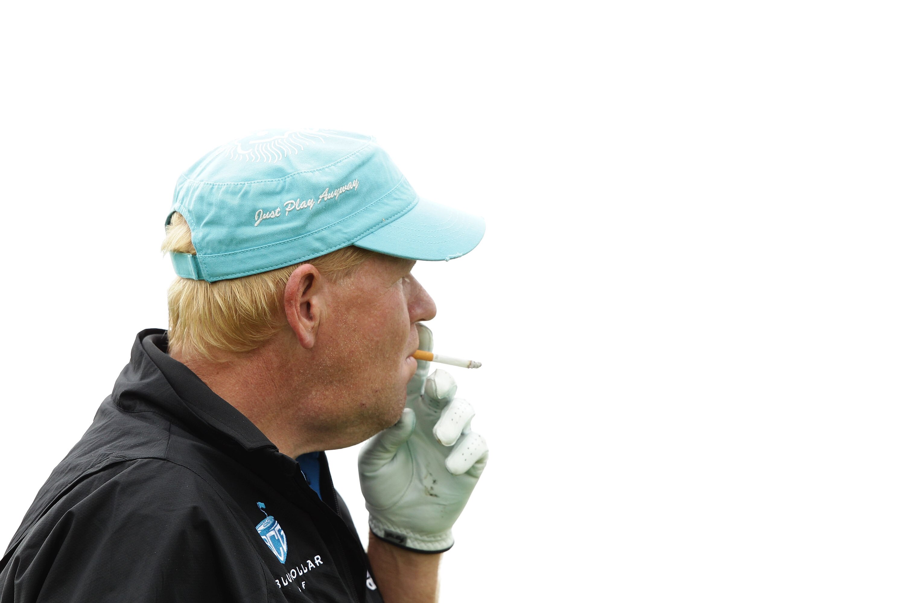 SYDNEY, AUSTRALIA - NOVEMBER 30:  John Daly of the United States smokes a cigarette ahead of the Australian Open at The Lakes Golf Club on November 30, 2010 in Sydney, Australia.  (Photo by Brendon Thorne/Getty Images)