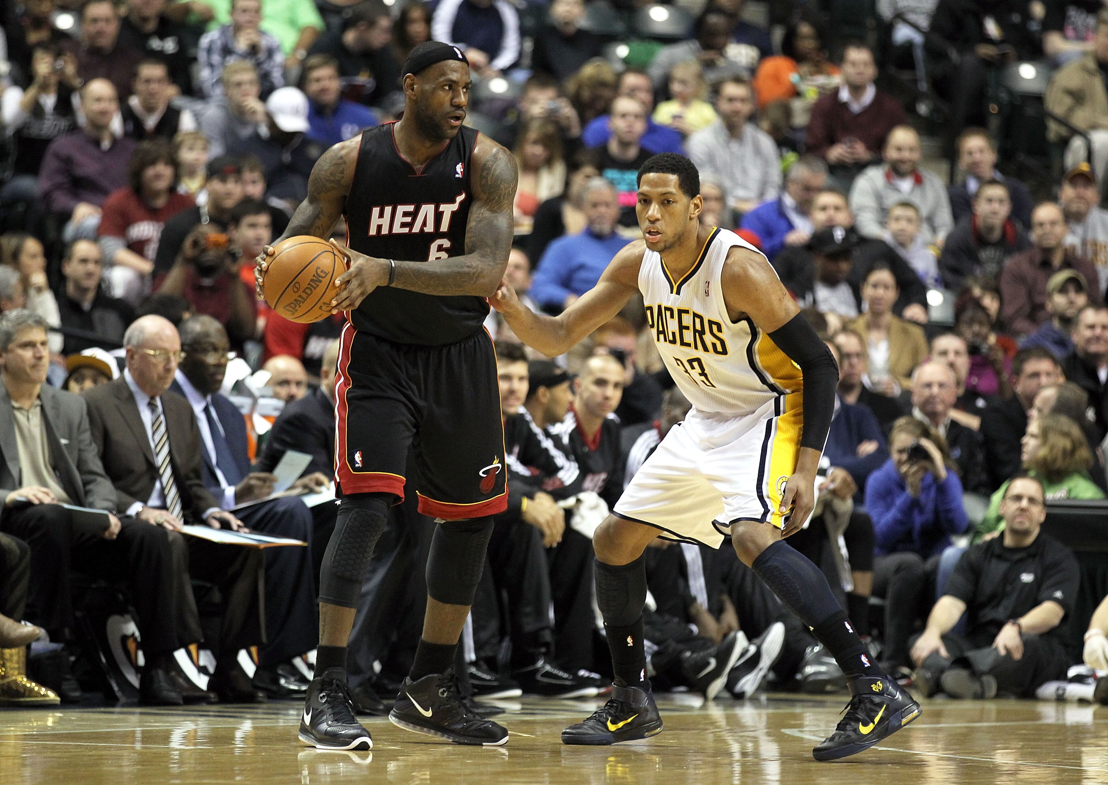 INDIANAPOLIS - FEBRUARY 15: LeBron James #6 of the Miami Heat is guarded by Danny Granger #33 of the Indiana Pacers during the NBA game at Conseco Fieldhouse on February 15, 2011 in Indianapolis, Indiana. The Heat won 110-103. NOTE TO USER: User expre INDIANAPOLIS - FEBRUARY 15: LeBron James #6 of the Miami Heat is guarded by Danny Granger #33 of the Indiana Pacers during the NBA game at Conseco Fieldhouse on February 15, 2011 in Indianapolis, Indiana. The Heat won 110-103. NOTE TO USER: User expre