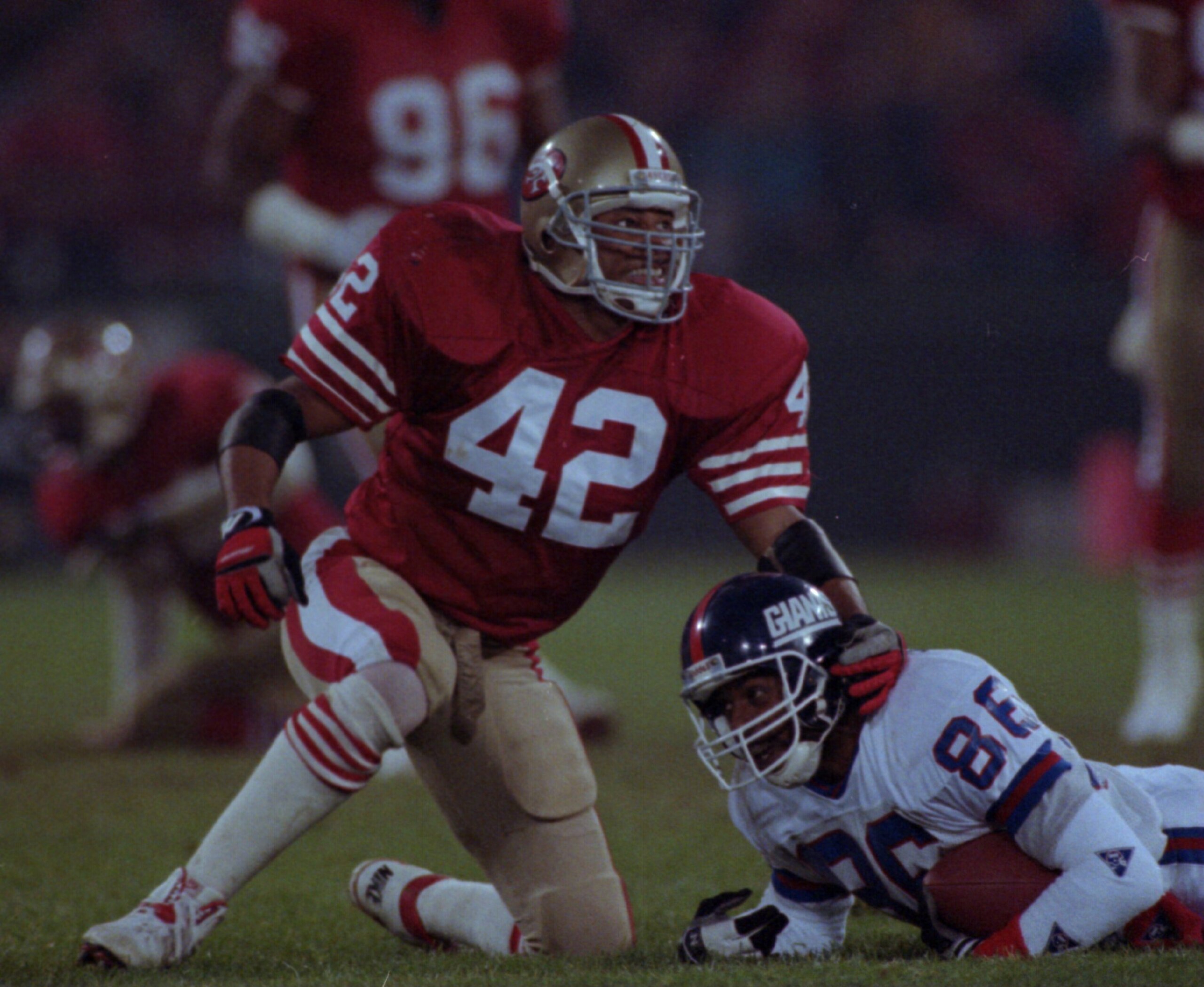 3 Dec 1990:  Strong safety Ronnie Lott of the San Francisco 49ers gives a little smile to one of his teammates as he finishes off a tackle during the 49ers 7-3 victory over the New York Giants at Candlestick Park in San Francisco, California.   Mandatory