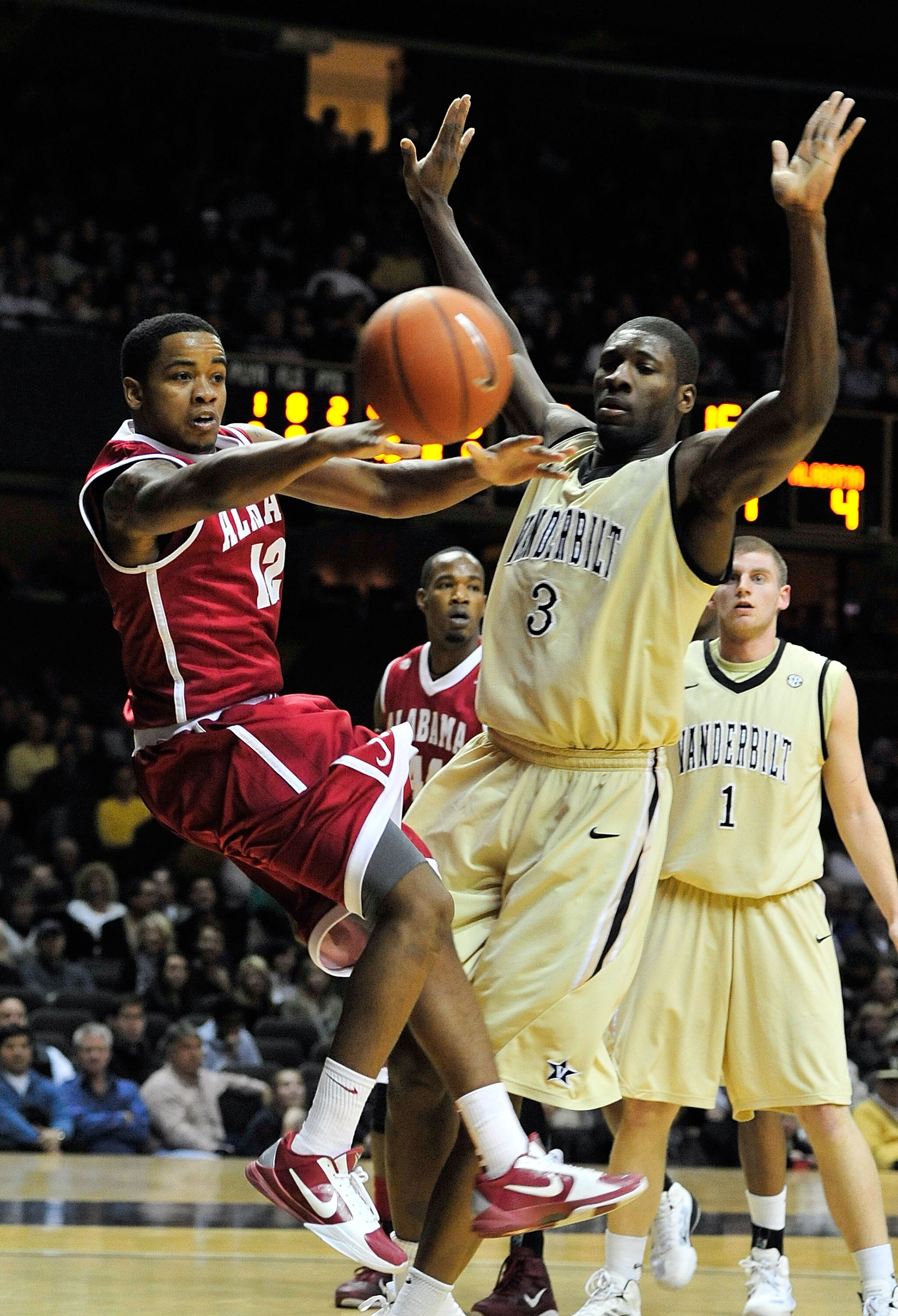 NASHVILLE, TN - FEBRUARY 10:  Trevor Releford #13 of the Alabama Crimson Tide drives against Festus Ezeli #3 of the Vanderbilt Commodores at Memorial Gym on February 10, 2011 in Nashville, Tennessee.  (Photo by Grant Halverson/Getty Images)
