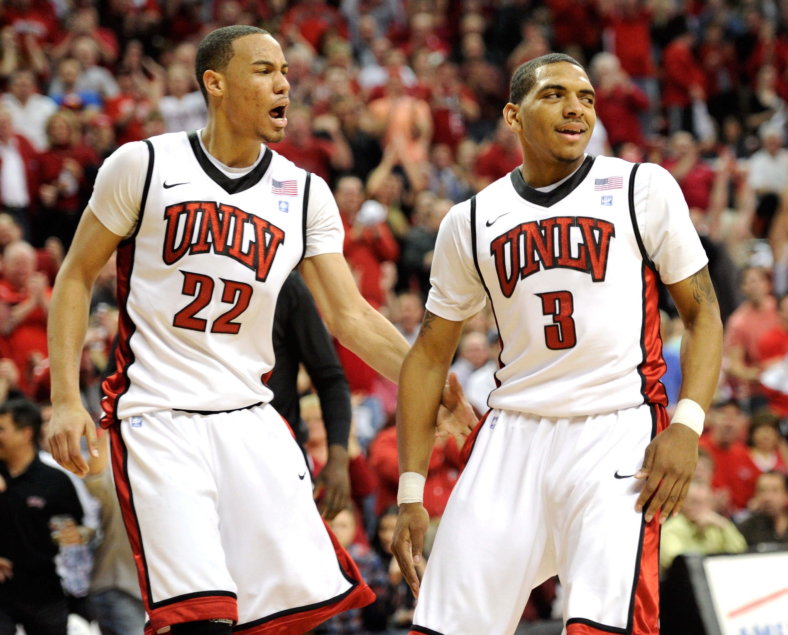 LAS VEGAS, NV - FEBRUARY 12:  Chace Stanback #22 and Anthony Marshall #3 of the UNLV Rebels react after Marshall took an offensive charge for a San Diego State Aztecs foul during their game at the Thomas & Mack Center February 12, 2011 in Las Vegas, Nevad