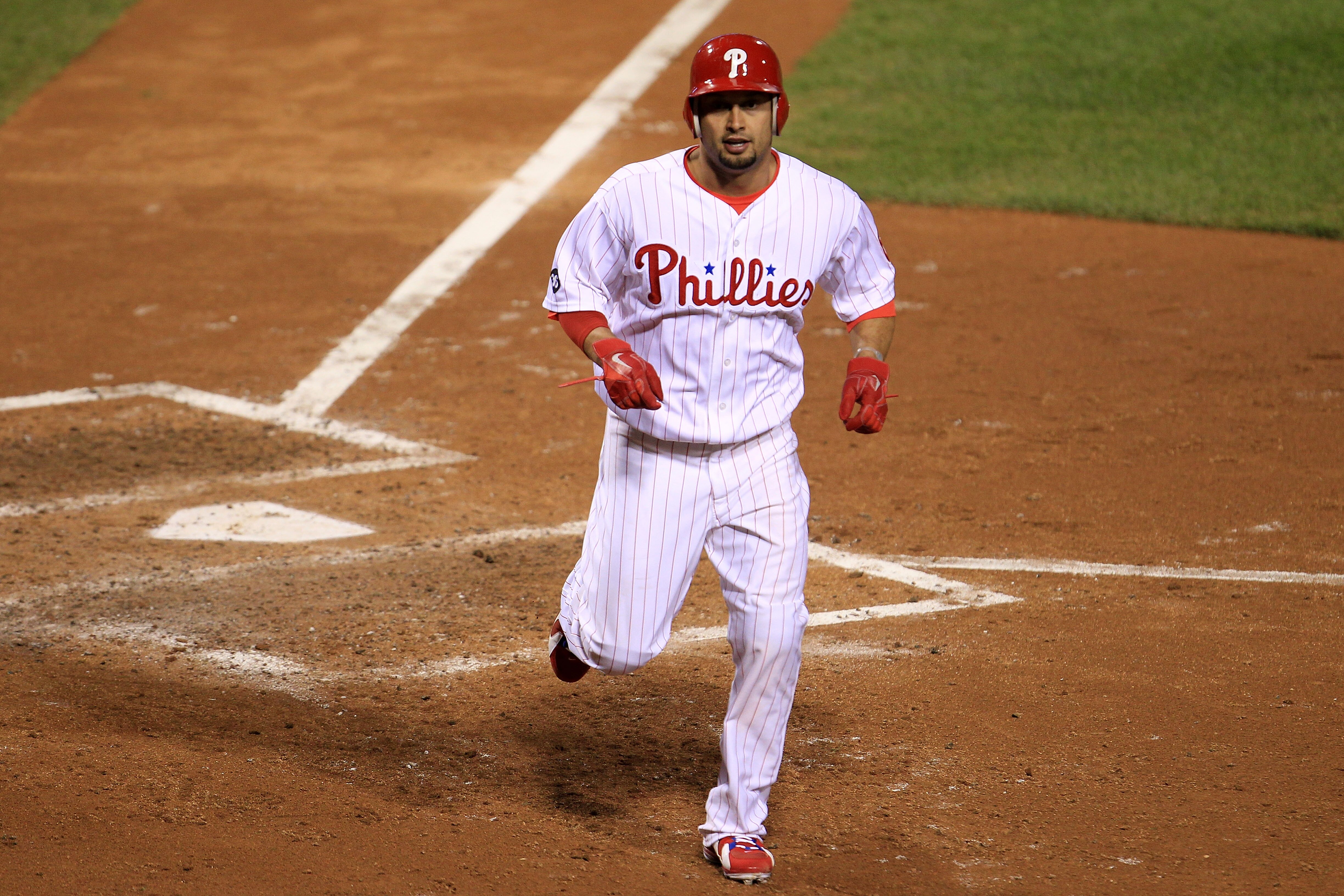 PHILADELPHIA - OCTOBER 17:  Shane Victorino #8 of the Philadelphia Phillies scores on a sacrifice fly by Placido Polanco #27 in the fifth inning against the San Francisco Giants in Game Two of the NLCS during the 2010 MLB Playoffs at Citizens Bank Park on