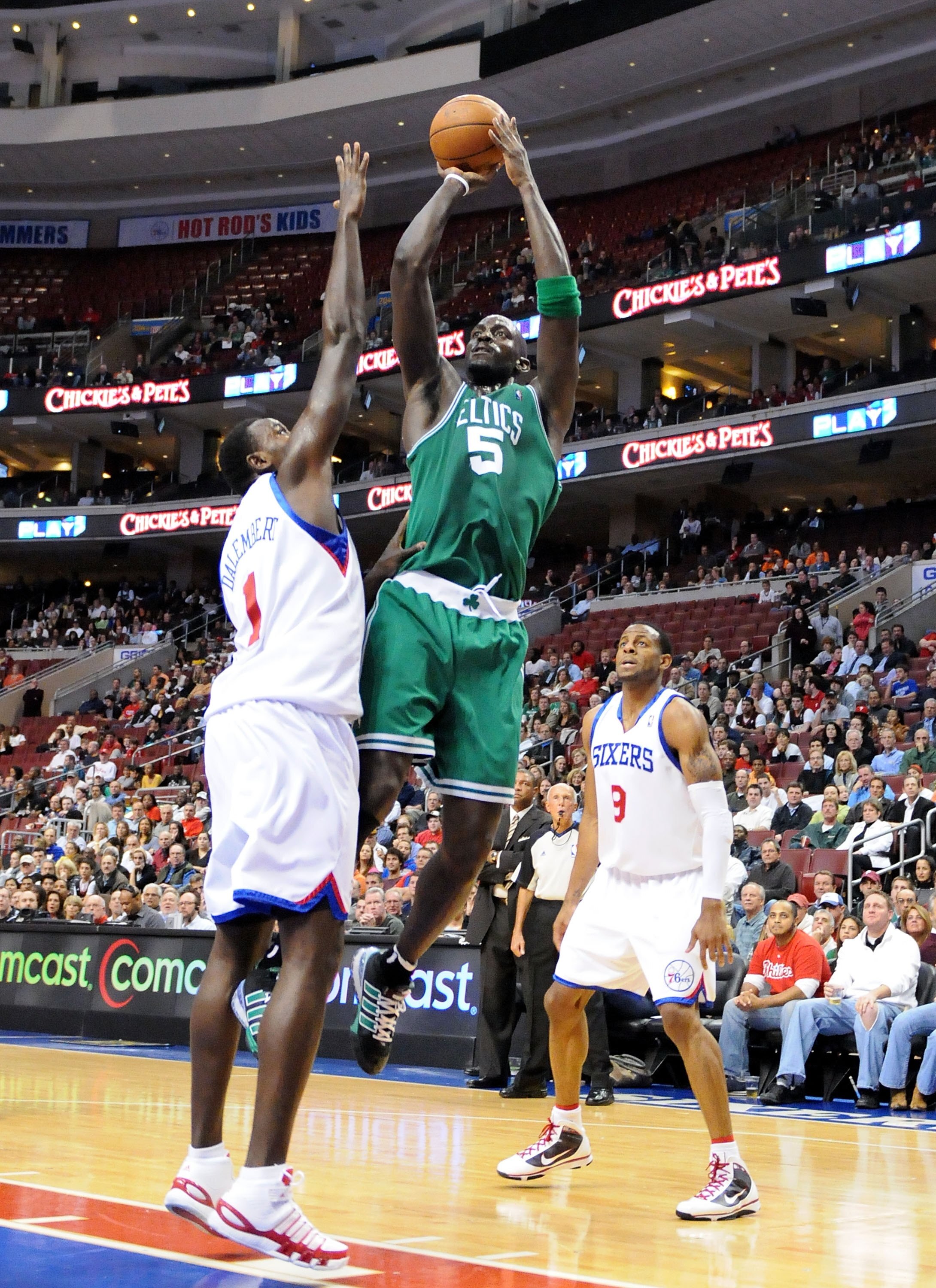 PHILADELPHIA - NOVEMBER 03:  Kevin Garnett #5 of the Boston Celtics attempts a shot against Samuel Dalembert #1 and Andre Iguodala #9 of the Philadelphia 76ers at the Wachovia Center on November 3, 2009 in Philadelphia, Pennsylvania.  NOTE TO USER: User e