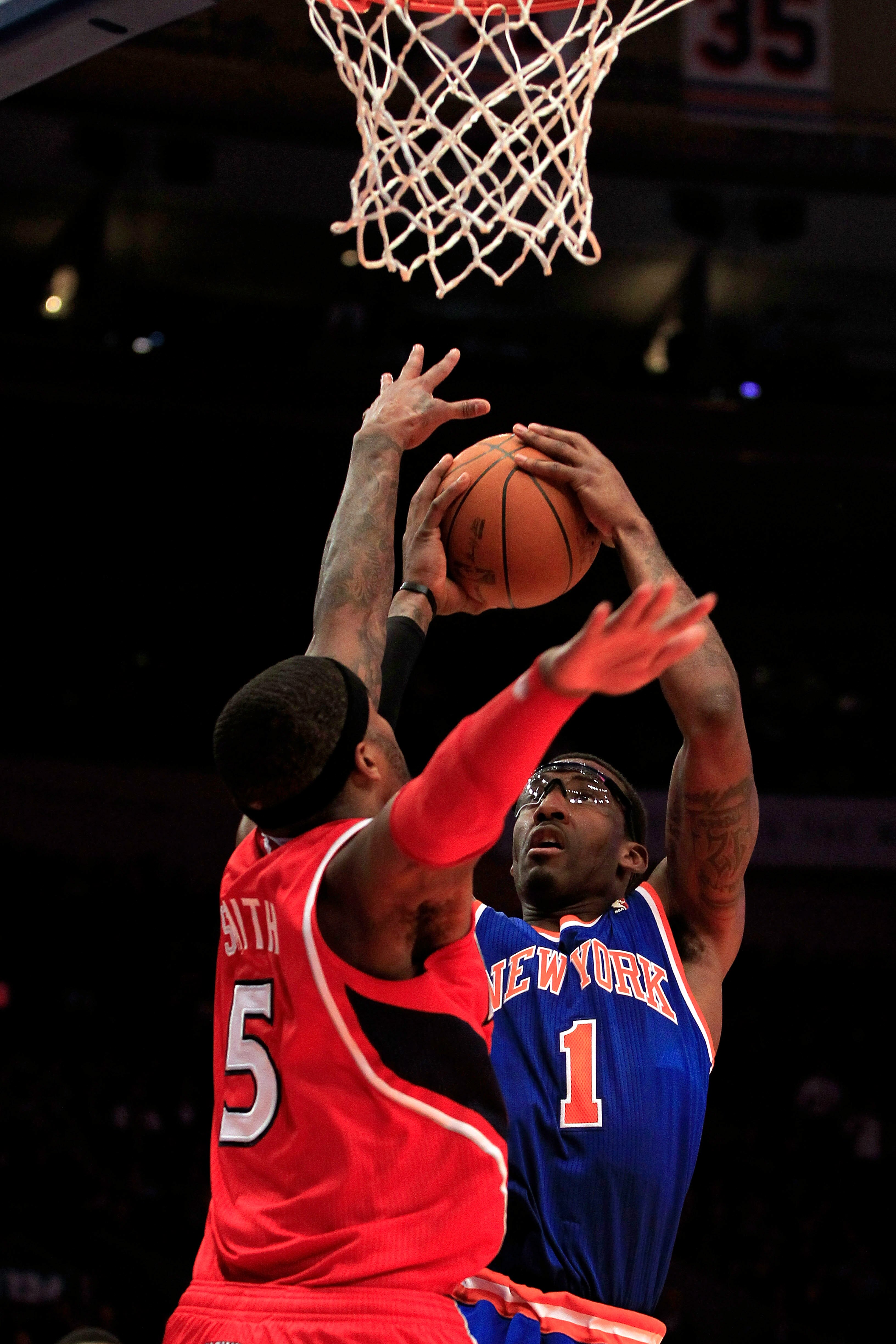 NEW YORK, NY - FEBRUARY 16:  Amar'e Stoudemire #1 of the New York Knicks shoots the ball over Josh Smith #5 of the Atlanta Hawks at Madison Square Garden on February 16, 2011 in New York City. NOTE TO USER: User expressly acknowledges and agrees that, by