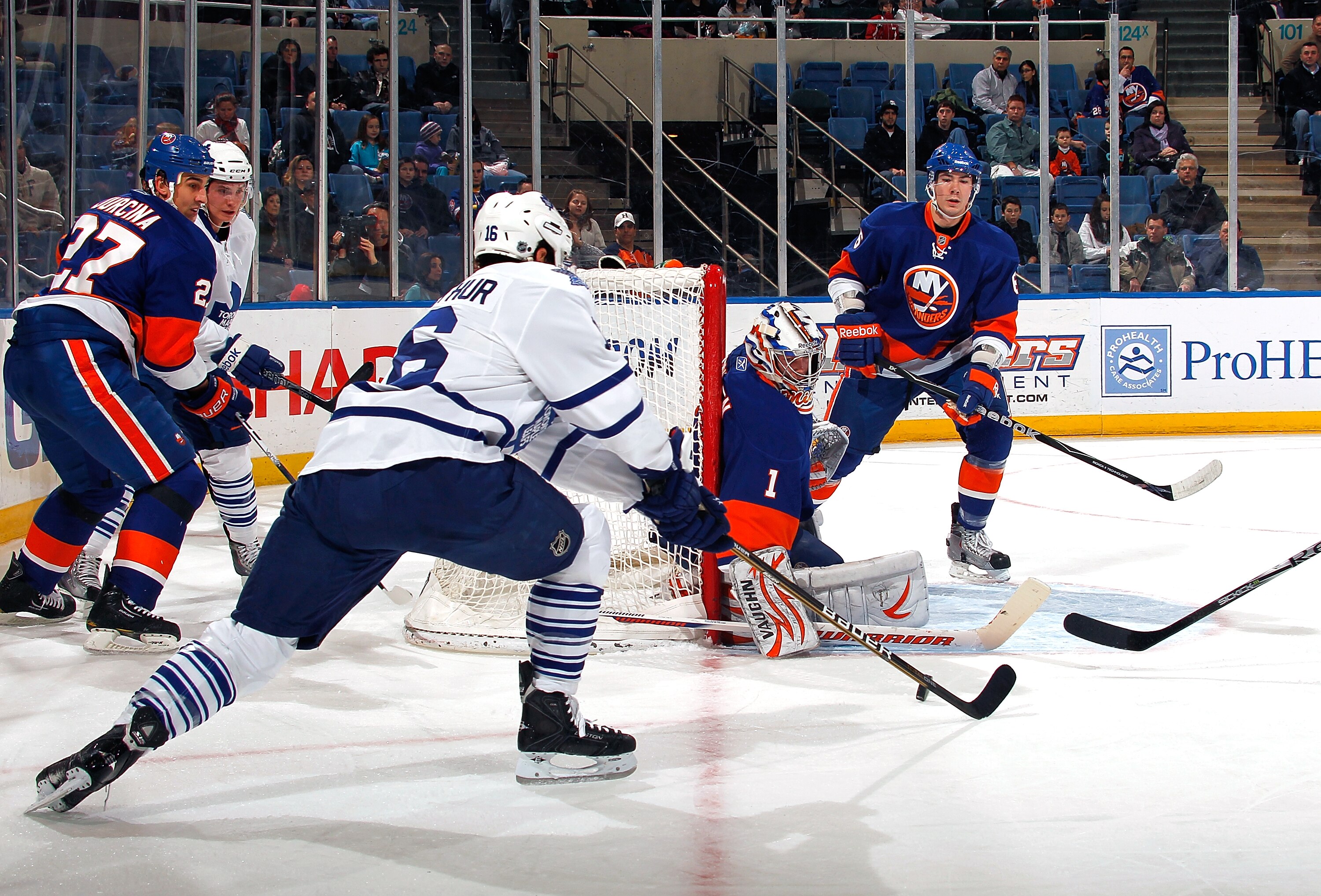 UNIONDALE, NY - FEBRUARY 08:  Mikko Koskinen #1 of the New York Islanders makes a save against Clarke MacArthur #16 of the Toronto Maple Leafs on February 8, 2011 at Nassau Colsium in Uniondale, New York.  (Photo by Lou Capozzola/Getty Images)