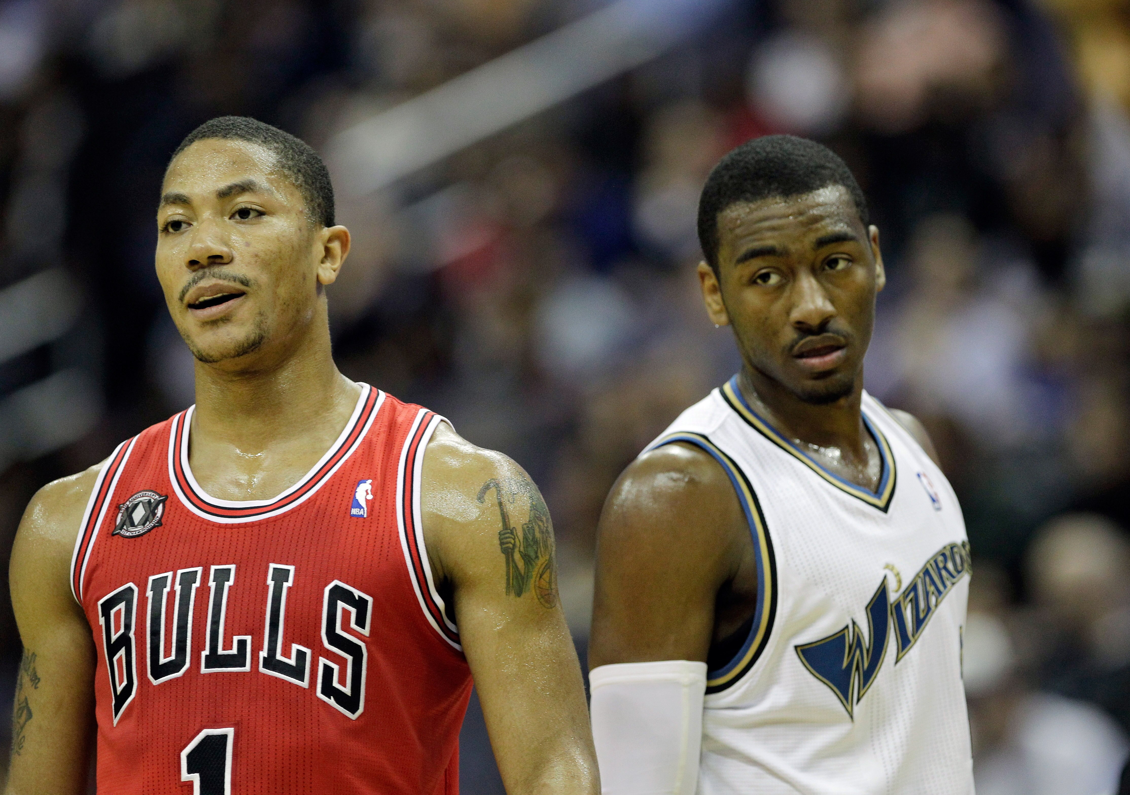 WASHINGTON, DC - FEBRUARY 28: John Wall #2 of the Washington Wizards (R) and Derrick Rose #1 of the Chicago Bulls (L) watch a foul shot at the Verizon Center in Washington on February 28, 2011 in Washington, DC. NOTE TO USER: User expressly acknowledges a WASHINGTON, DC - FEBRUARY 28: John Wall #2 of the Washington Wizards (R) and Derrick Rose #1 of the Chicago Bulls (L) watch a foul shot at the Verizon Center in Washington on February 28, 2011 in Washington, DC. NOTE TO USER: User expressly acknowledges a