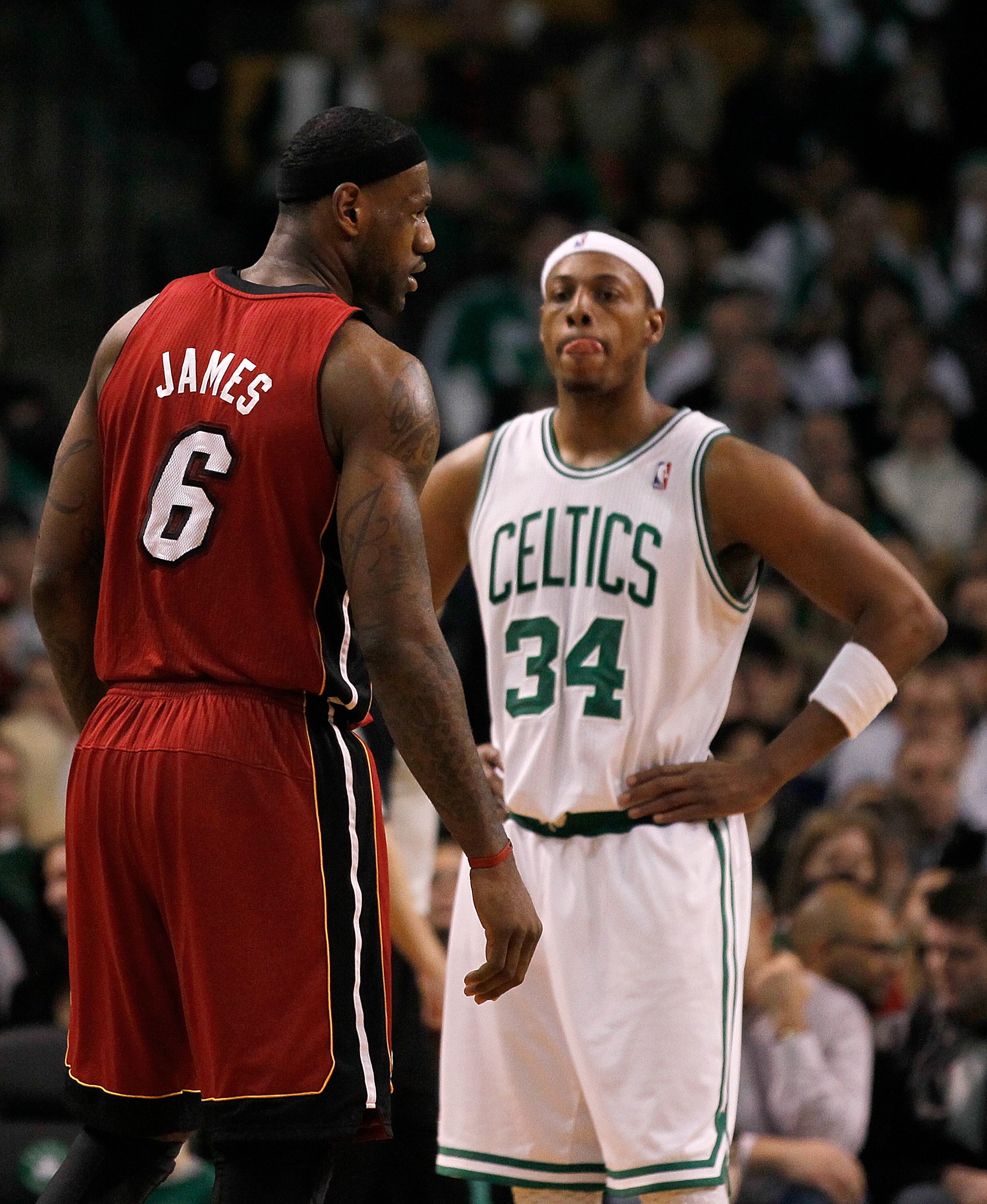 BOSTON - FEBRUARY 13:  LeBron James #6 of the Miami Heat and Paul Pierce #34 of the Boston Celtics take a breather at TD Garden on February 13, 2011 in Boston, Massachusetts. NOTE TO USER: User expressly acknowledges and agrees that, by downloading and/or