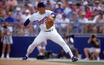 ARLINGTON, TX - 1990s:  Nolan Ryan #34 of the Texas Rangers pitches during a circa 1990s game at Arlington Stadium in Arlington, Texas. Ryan pitched for the Rangers from 1989-93.  (Photo by Jonathan Daniel/Getty Images)
