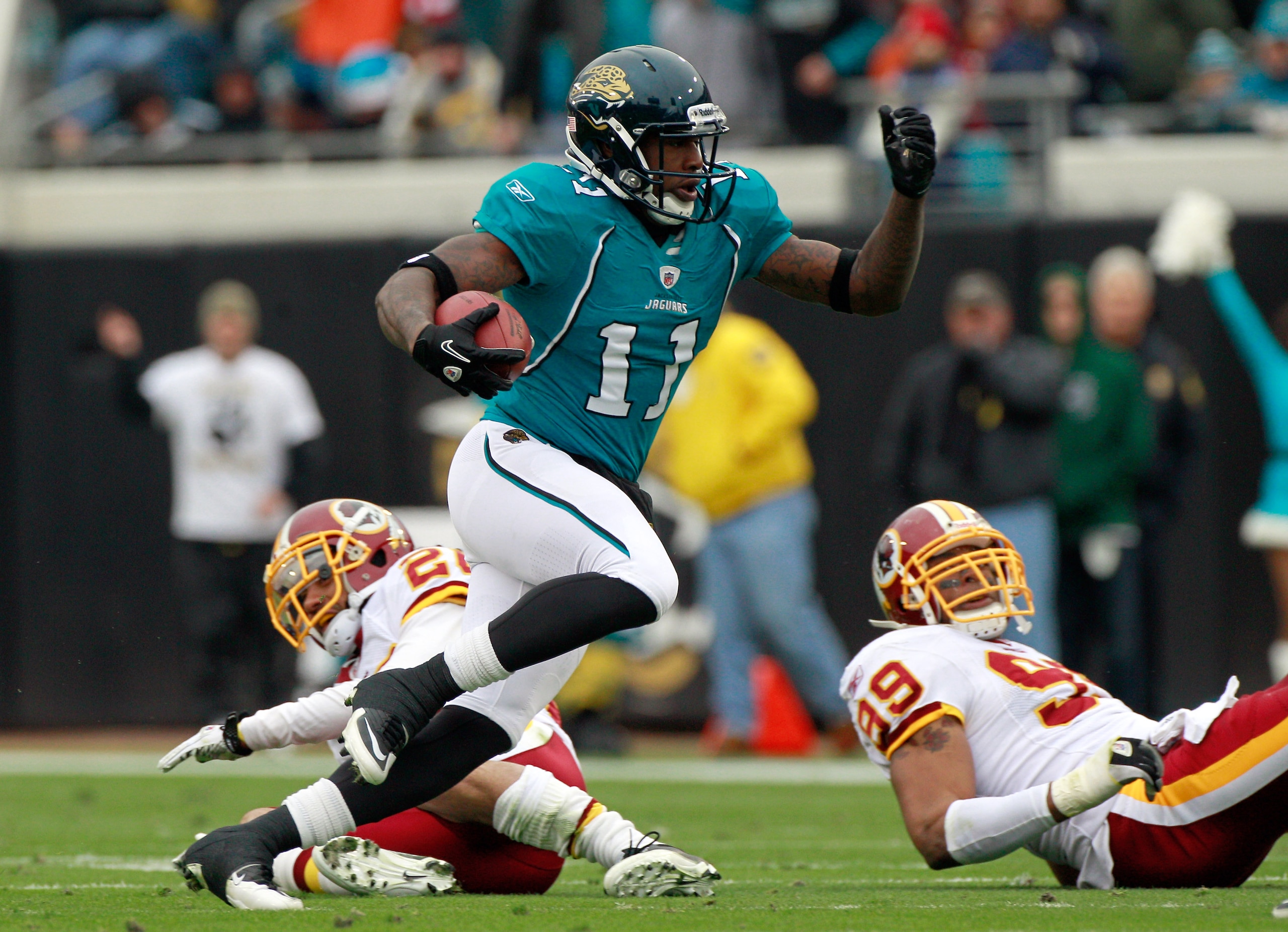 JACKSONVILLE, FL - DECEMBER 26:  Mike Sims-Walker #11 of the Jacksonville Jaguars runs after making a reception during the game against the Washington Redskins at EverBank Field on December 26, 2010 in Jacksonville, Florida.  (Photo by Sam Greenwood/Getty