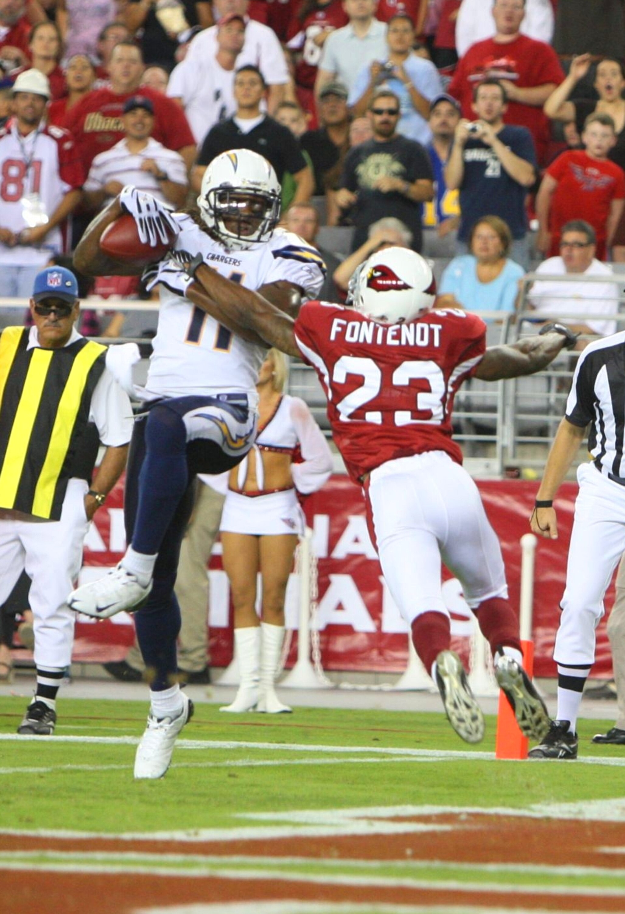 GLENDALE, AZ - AUGUST 22:  Legedu Naanee #11 of the San Diego Chargers  leaps for the touchdown in the second quarter against Wilrey Fontenot #23 of the Arizona Cardinals at the University of Phoenix Stadium on August 22, 2009 in Glendale, Arizona. (Photo