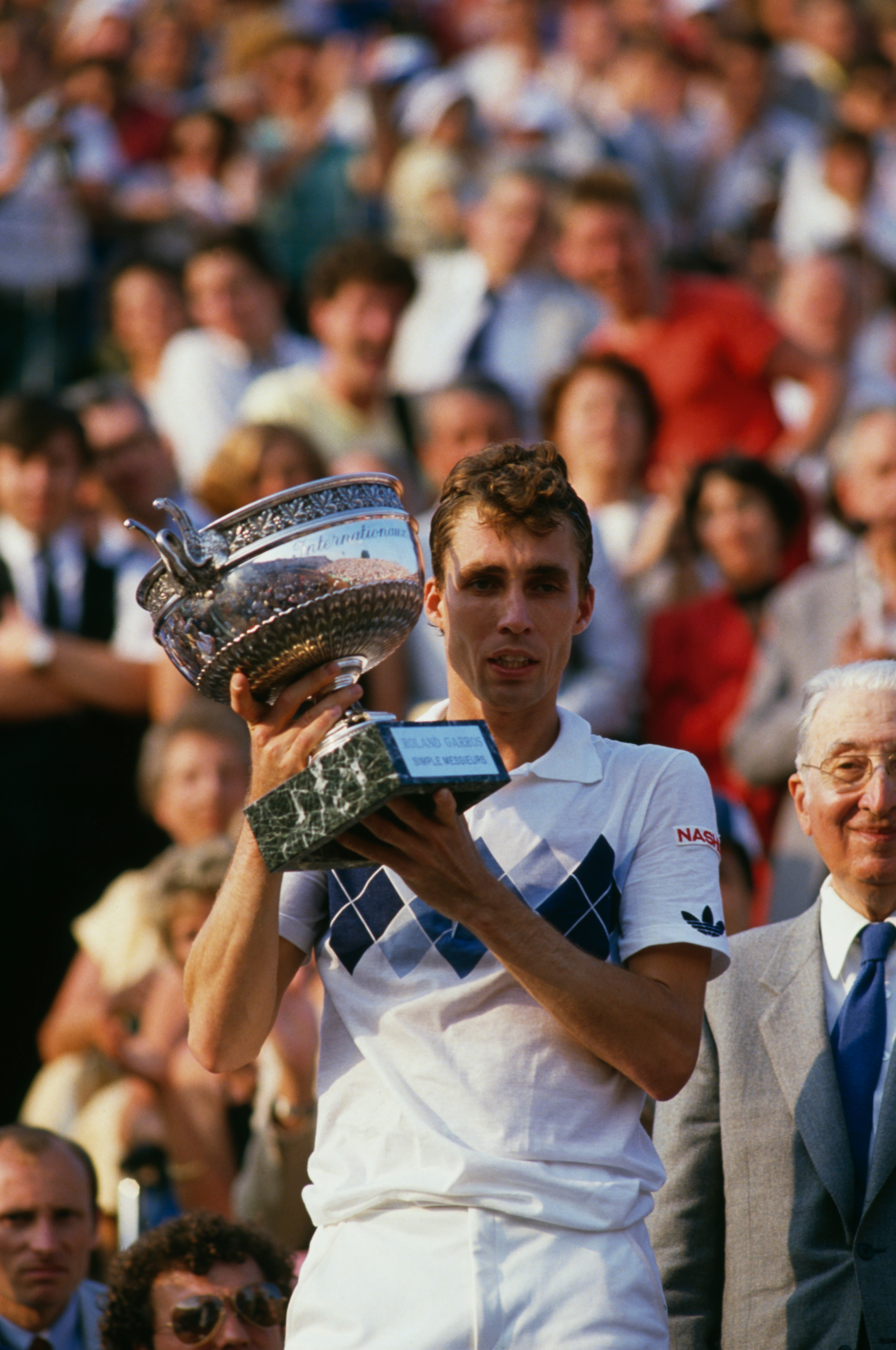 Czech tennis player Ivan Lendl with the trophy after winning the men's singles final of the Tournoi de Roland-Garros (French Open), at the Stade Roland Garros, Paris, June 1984. Lendl beat John McEnroe of the USA to win the match 3-6, 2-6, 6-4, 7-5, 7-5.