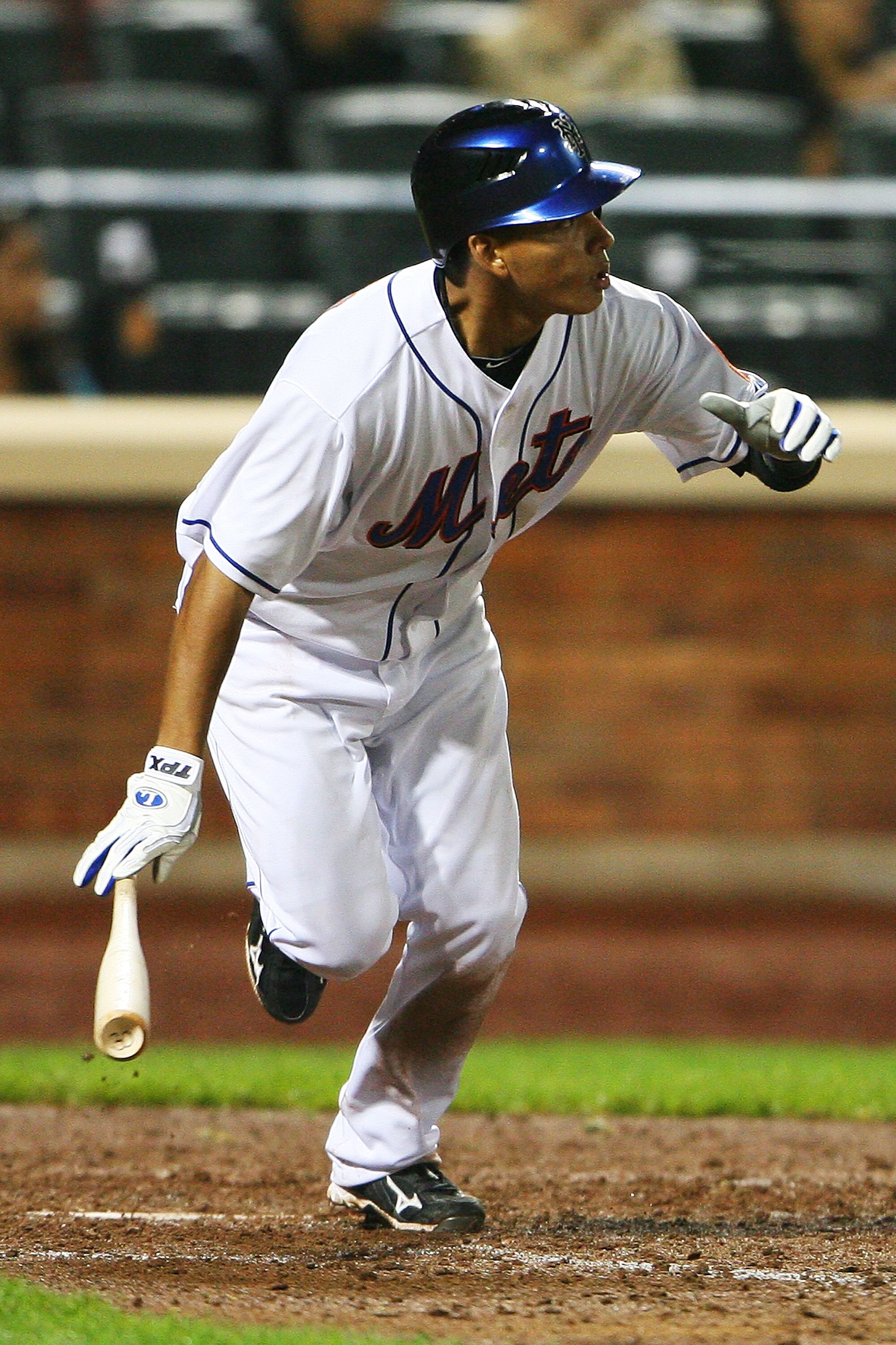 NEW YORK - SEPTEMBER 28:  Ruben Tejada #11 of the New York Mets runs after hitting a walk off two run double in the ninth inning, which helped defeat the Milwaukee Brewers 4 - 3 on September 28, 2010 at Citi Field in the Flushing neighborhood of the Queen