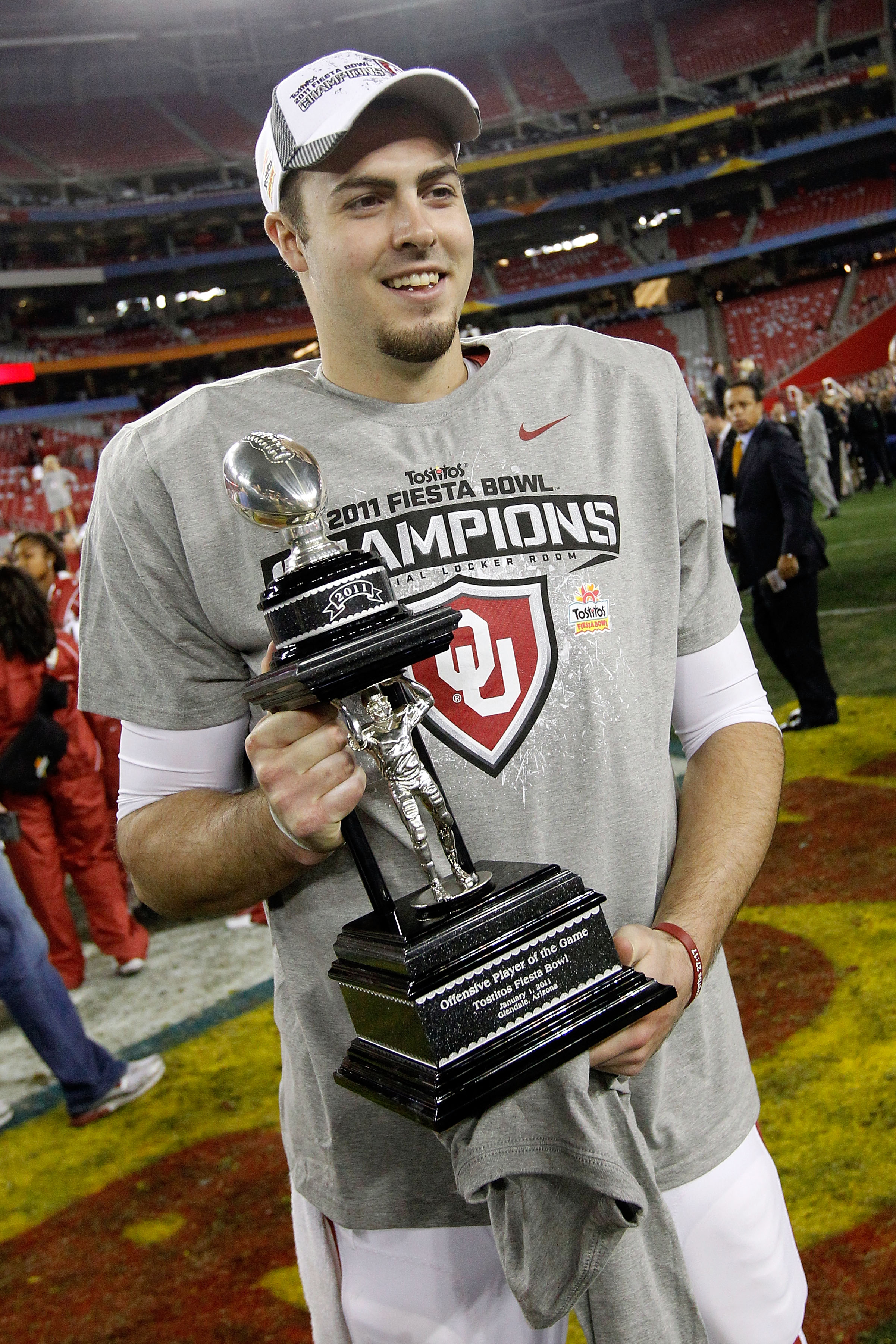 GLENDALE, AZ - JANUARY 01:  Quarterback Landry Jones #12 of the Oklahoma Sooners and offensive MVP celebrates the Sooners 48-20 victory against the Connecticut Huskies during the Tostitos Fiesta Bowl at the Universtity of Phoenix Stadium on January 1, 201