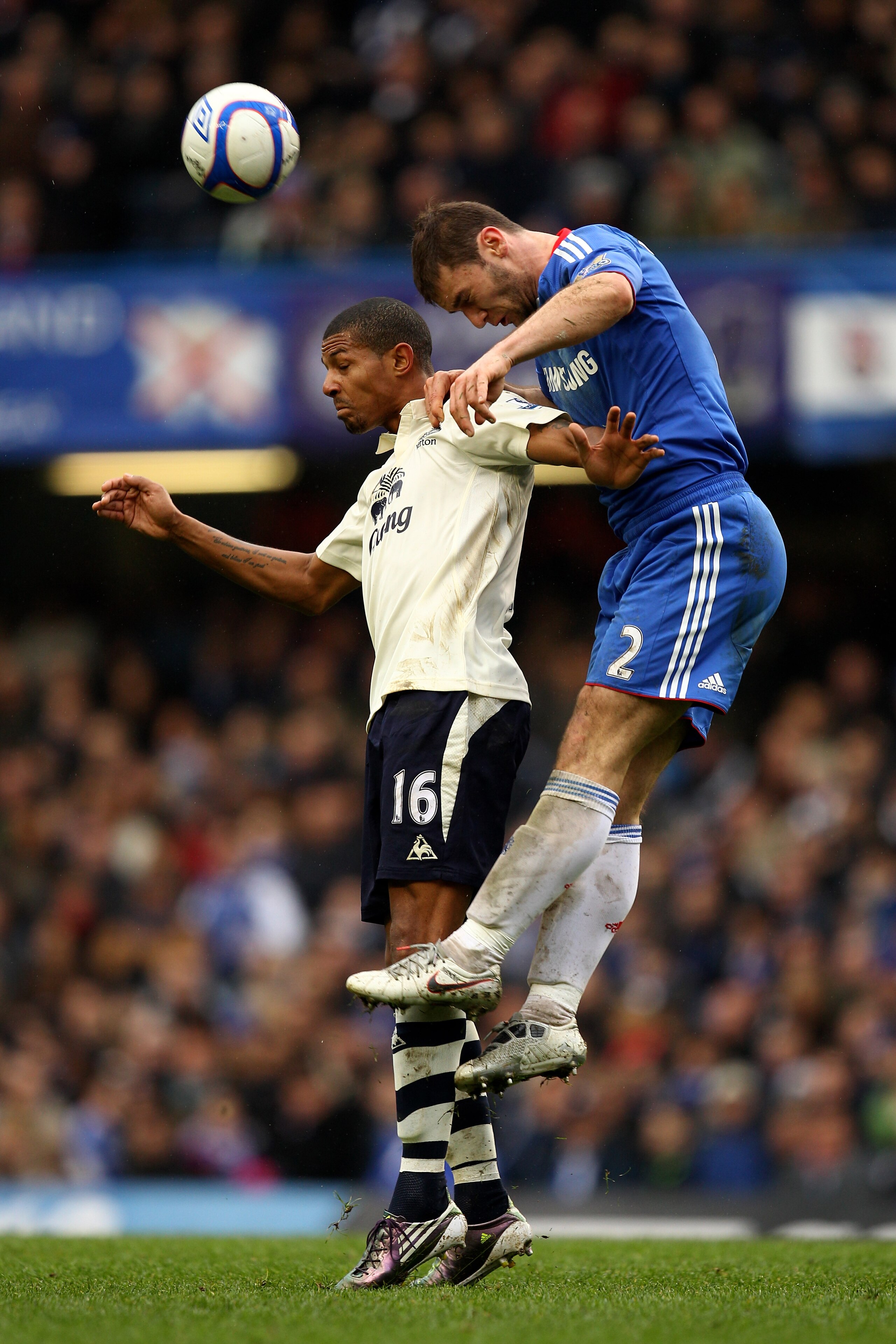 LONDON, ENGLAND - FEBRUARY 19:  Branislav Ivanovic of Chelsea rises above Jermaine Beckford of Everton to win a header during the FA Cup sponsored by E.ON 4th round replay match between Chelsea and Everton at Stamford Bridge on February 19, 2011 in London