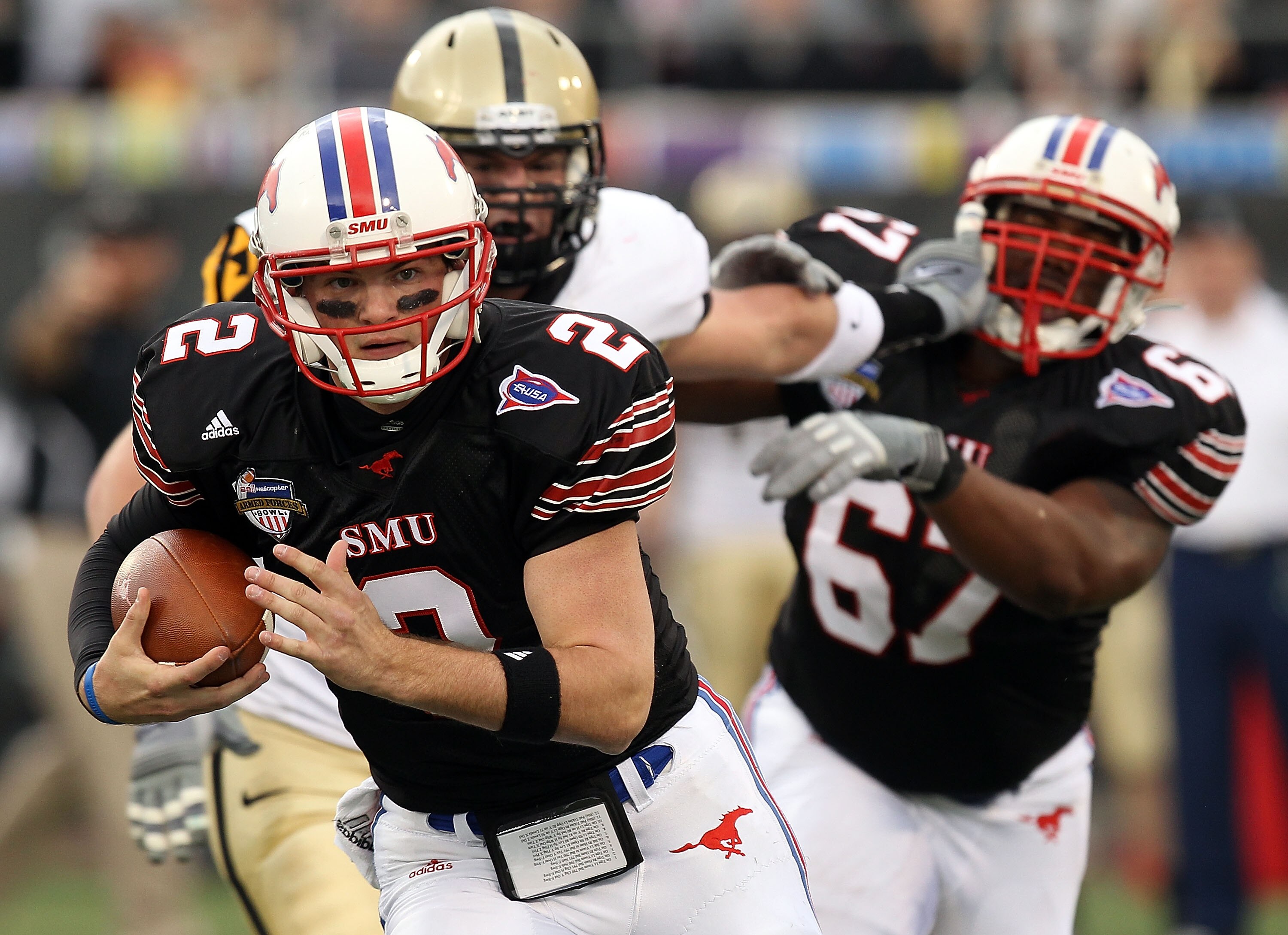 DALLAS, TX - DECEMBER 30: Quarterback Kyle Padron #2 of the SMU Mustangs runs the ball against the Army Black Knights during the Bell Helicopter Armed Forces Bowl at Gerald J. Ford Stadium on December 30, 2010 in Dallas, Texas. (Photo by Ronald Martinez DALLAS, TX - DECEMBER 30: Quarterback Kyle Padron #2 of the SMU Mustangs runs the ball against the Army Black Knights during the Bell Helicopter Armed Forces Bowl at Gerald J. Ford Stadium on December 30, 2010 in Dallas, Texas. (Photo by Ronald Martinez