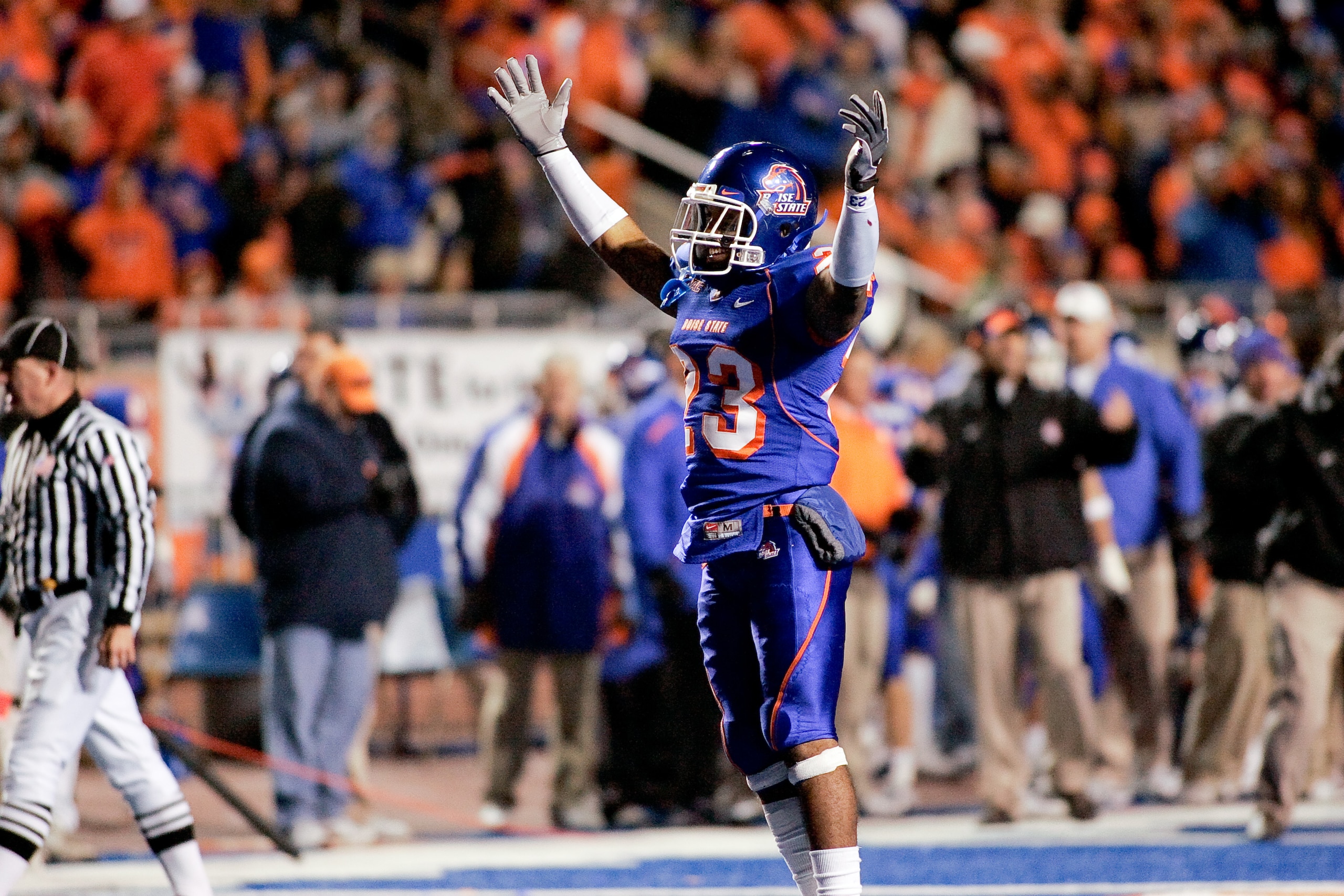 BOISE, ID - NOVEMBER 28: Jeron Johnson #23 of the Boise State Broncos celebrates a touchdown during their game against the Fresno State Bulldogs on November 28, 2008 at Bronco Stadium in Boise, Idaho.  (Photo by Otto Kitsinger III/Getty Images)