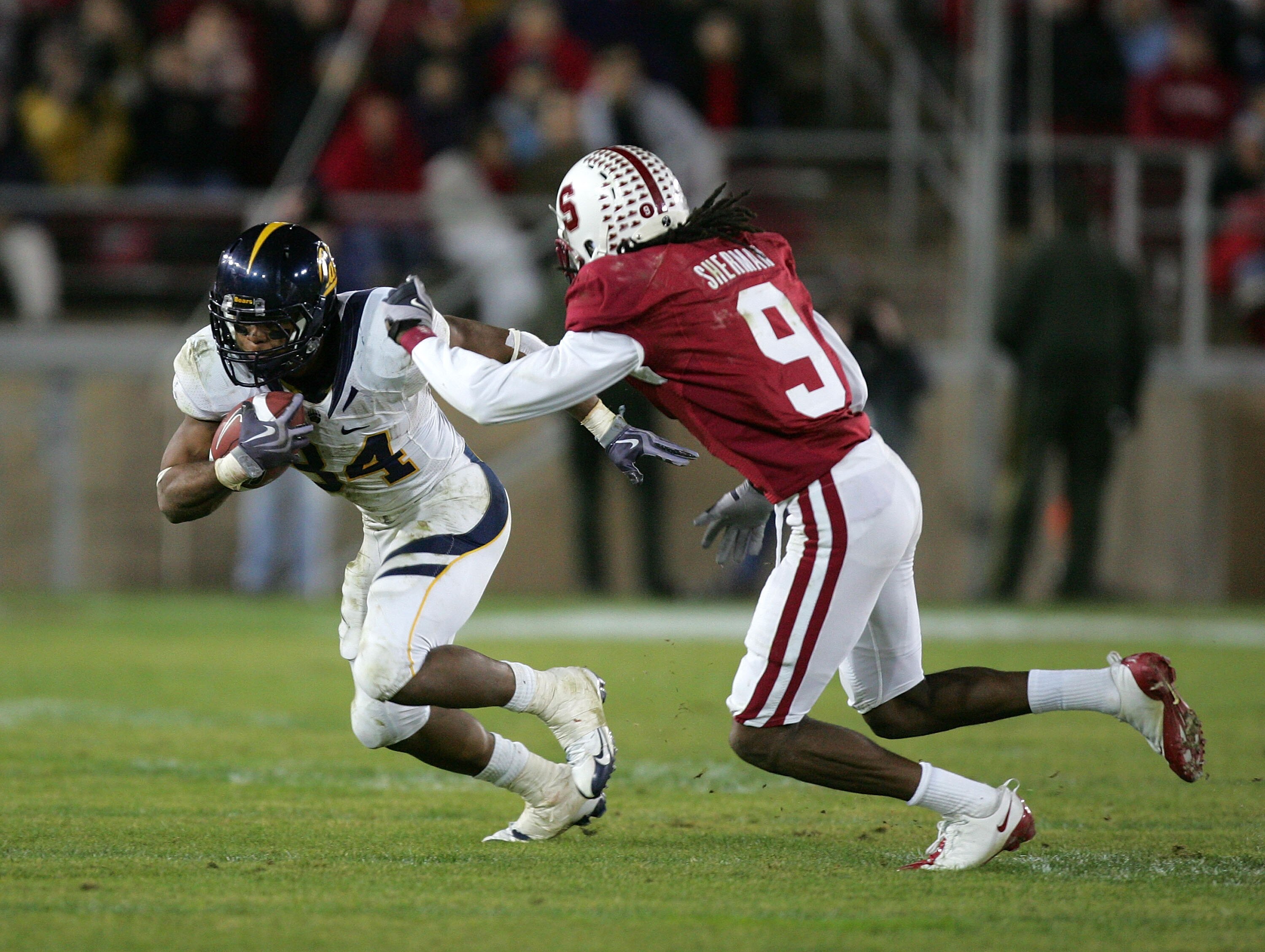 PALO ALTO, CA - NOVEMBER 21:  Shane Vereen #34 of the California Bears tries to run around Richard Sherman #9 of the Stanford Cardinal at Stanford Stadium on November 21, 2009 in Palo Alto, California.  (Photo by Ezra Shaw/Getty Images)