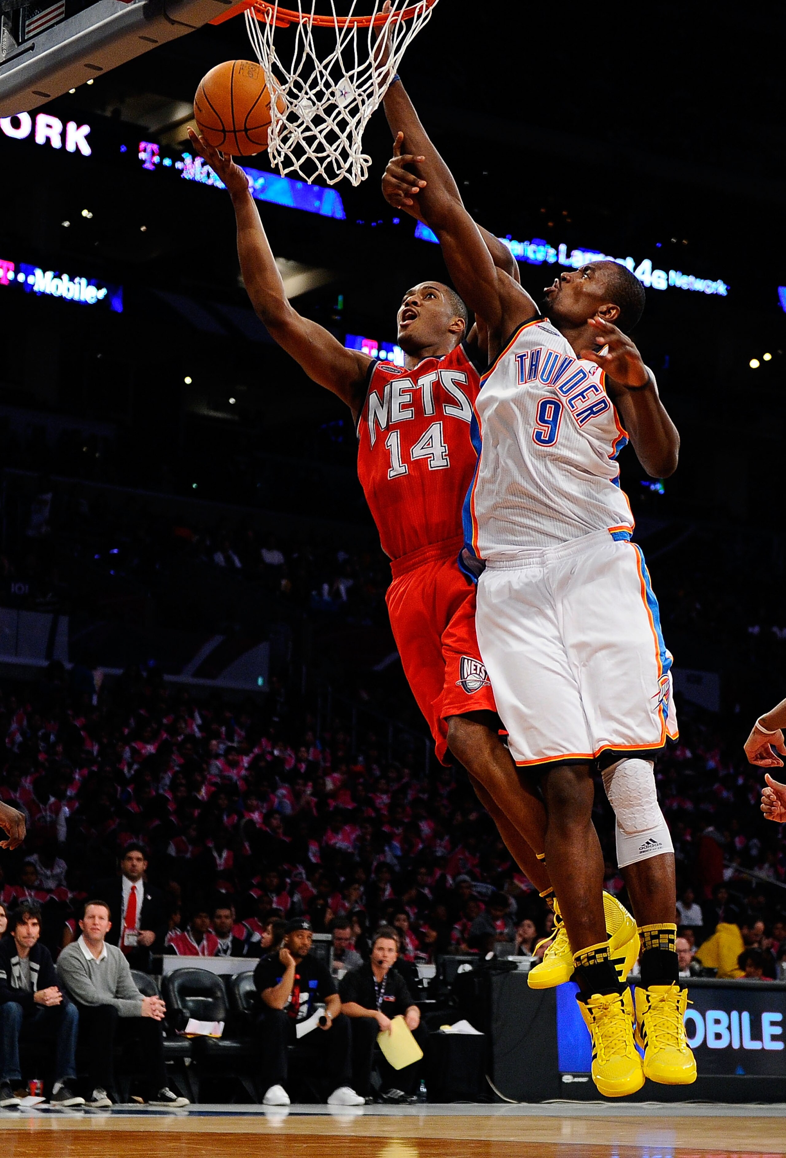 LOS ANGELES, CA - FEBRUARY 18:  Derrick Favors #14 of the New Jersey Nets and the Rookie Team goes up for a shot against Serge Ibaka #9 of the Oklahoma City Thunder and the Sophomore Team in the second half during the T-Mobile Rookie Challenge and Youth J