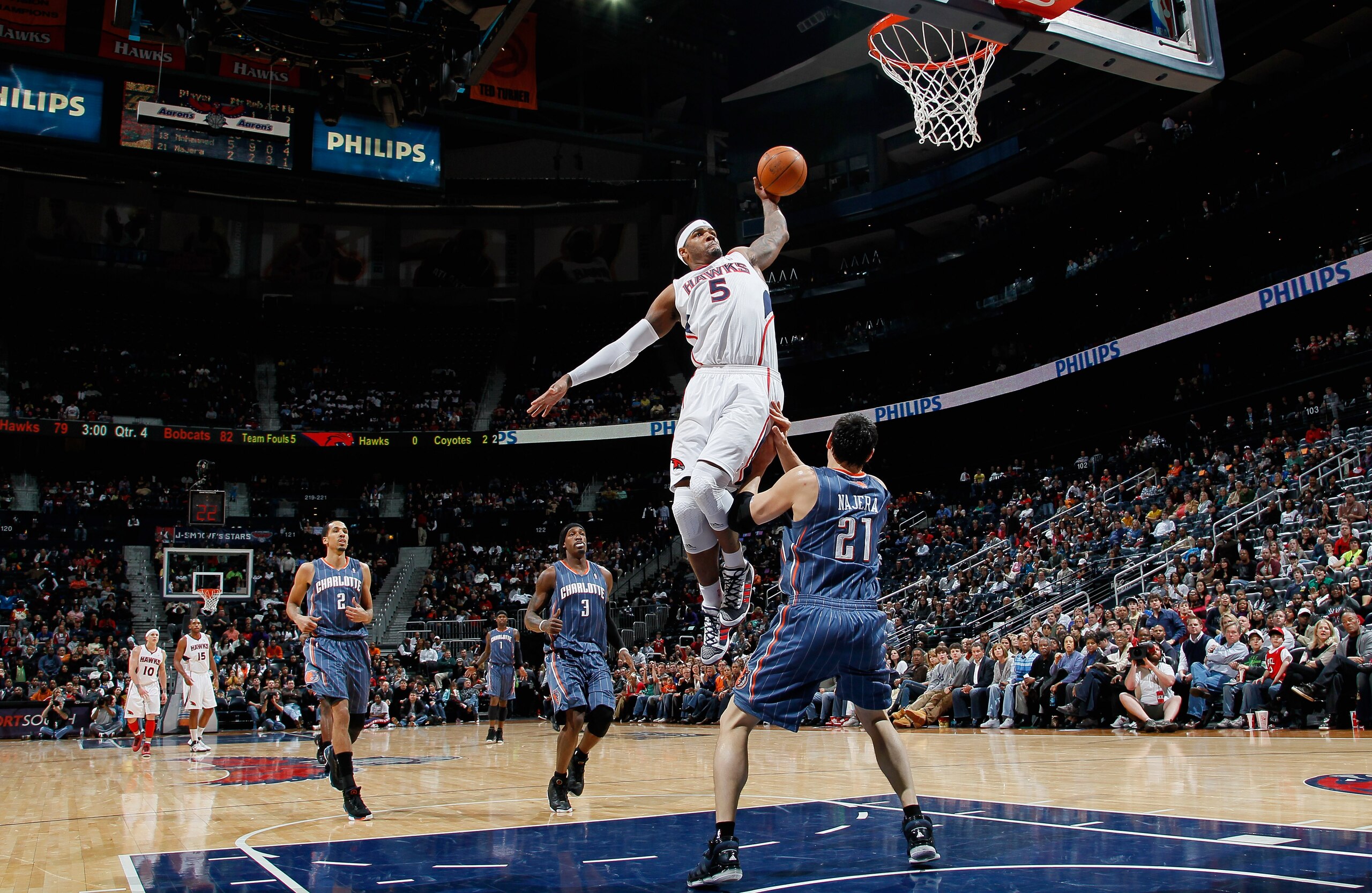 ATLANTA, GA - FEBRUARY 12: Josh Smith #5 of the Atlanta Hawks dunks over Eduardo Najera #21 of the Charlotte Bobcats at Philips Arena on February 12, 2011 in Atlanta, Georgia. NOTE TO USER: User expressly acknowledges and agrees that, by downloading and ATLANTA, GA - FEBRUARY 12: Josh Smith #5 of the Atlanta Hawks dunks over Eduardo Najera #21 of the Charlotte Bobcats at Philips Arena on February 12, 2011 in Atlanta, Georgia. NOTE TO USER: User expressly acknowledges and agrees that, by downloading and