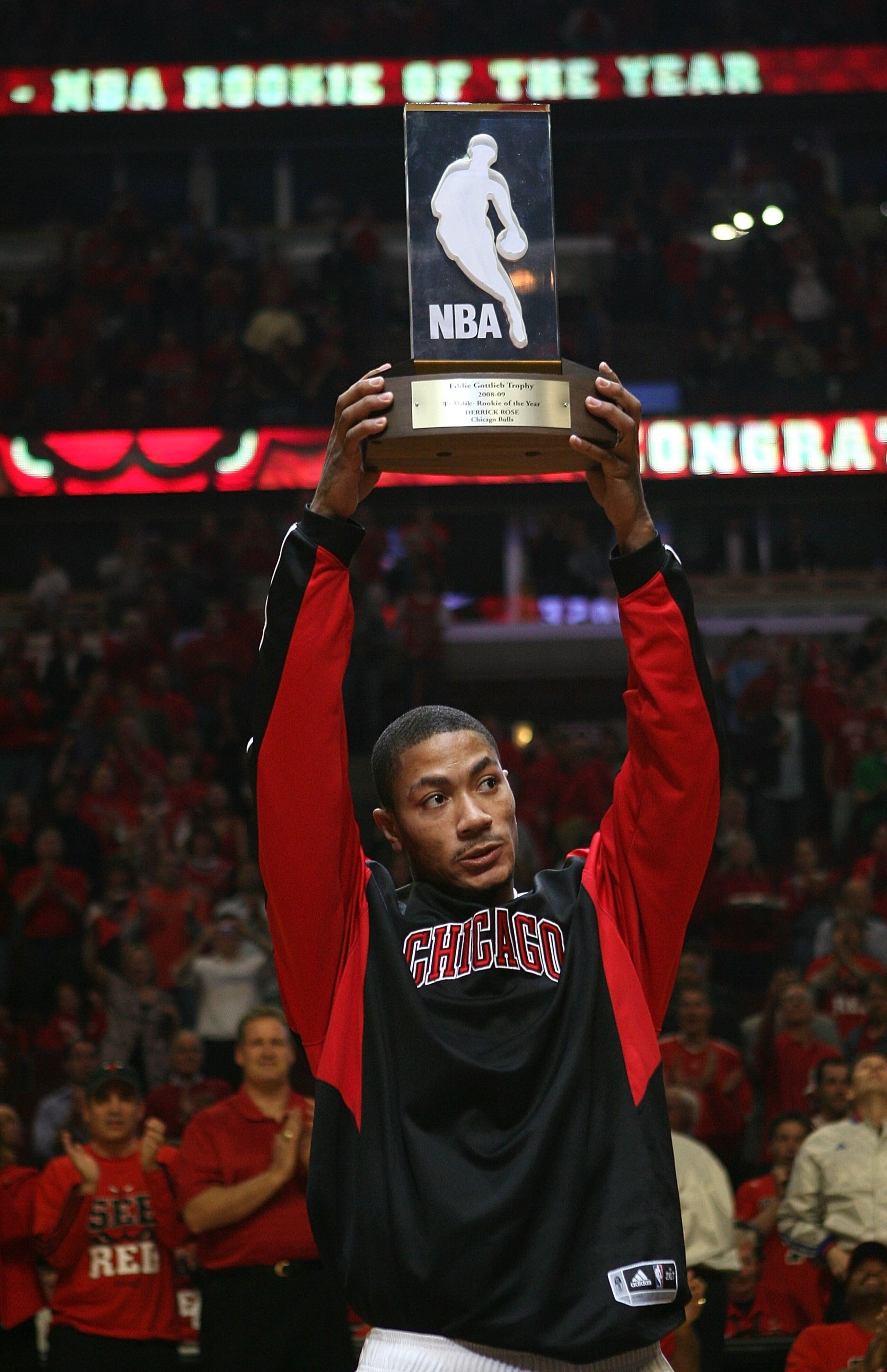 CHICAGO - APRIL 23: Derrick Rose #1 of the Chicago Bulls holds the NBA Rookie of the Year trophy in a pre-game ceremony before the Bulls take on the Boston Celtics in Game Three of the Eastern Conference Quarterfinals during the 2009 NBA Playoffs at the U