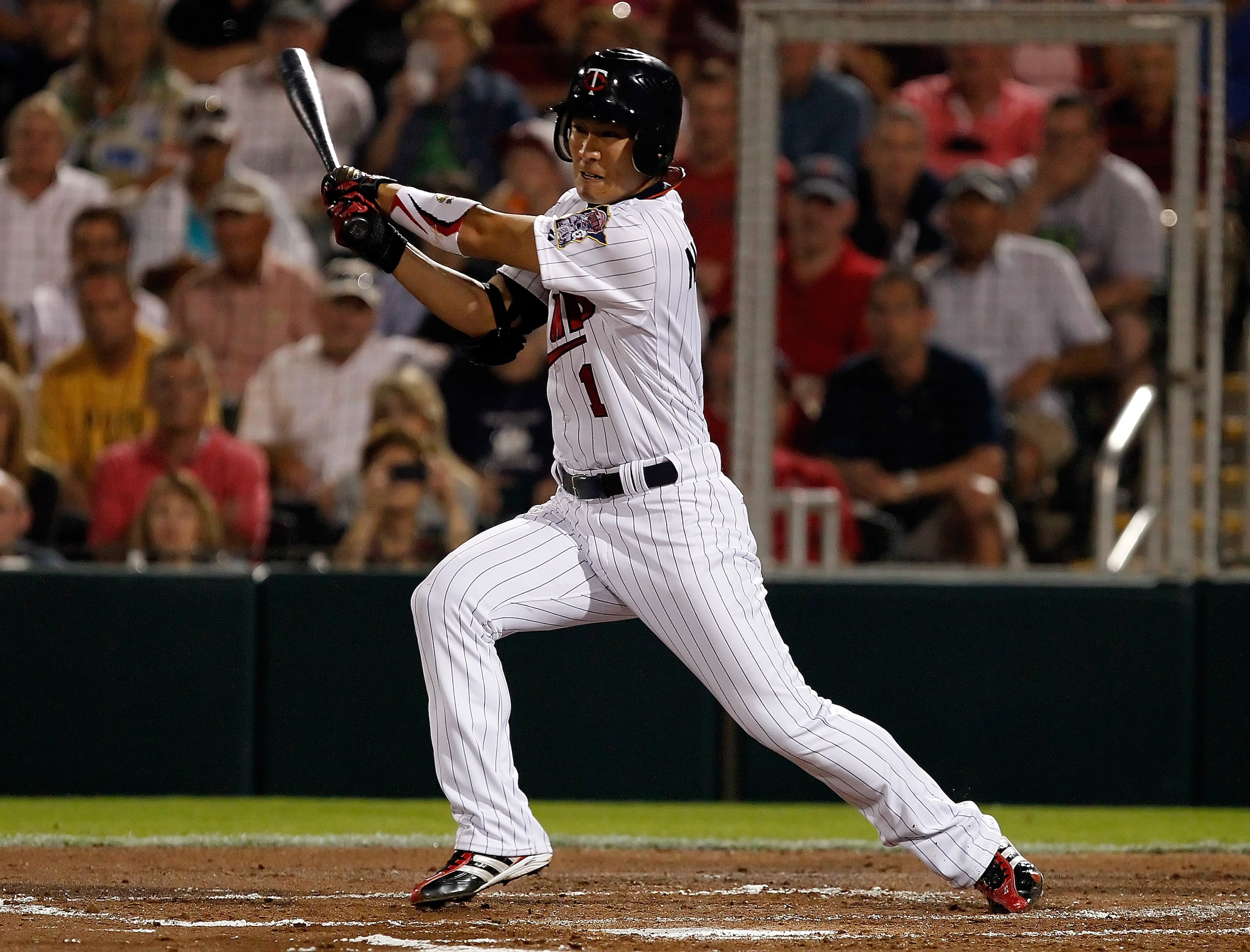 FORT MYERS, FL - FEBRUARY 27:  Infielder Tsuyoshi Nishioka #1 of the Minnesota Twins bats against the Boston Red Sox during a Grapefruit League Spring Training Game at Hammond Stadium on February 27, 2011 in Fort Myers, Florida.  (Photo by J. Meric/Getty