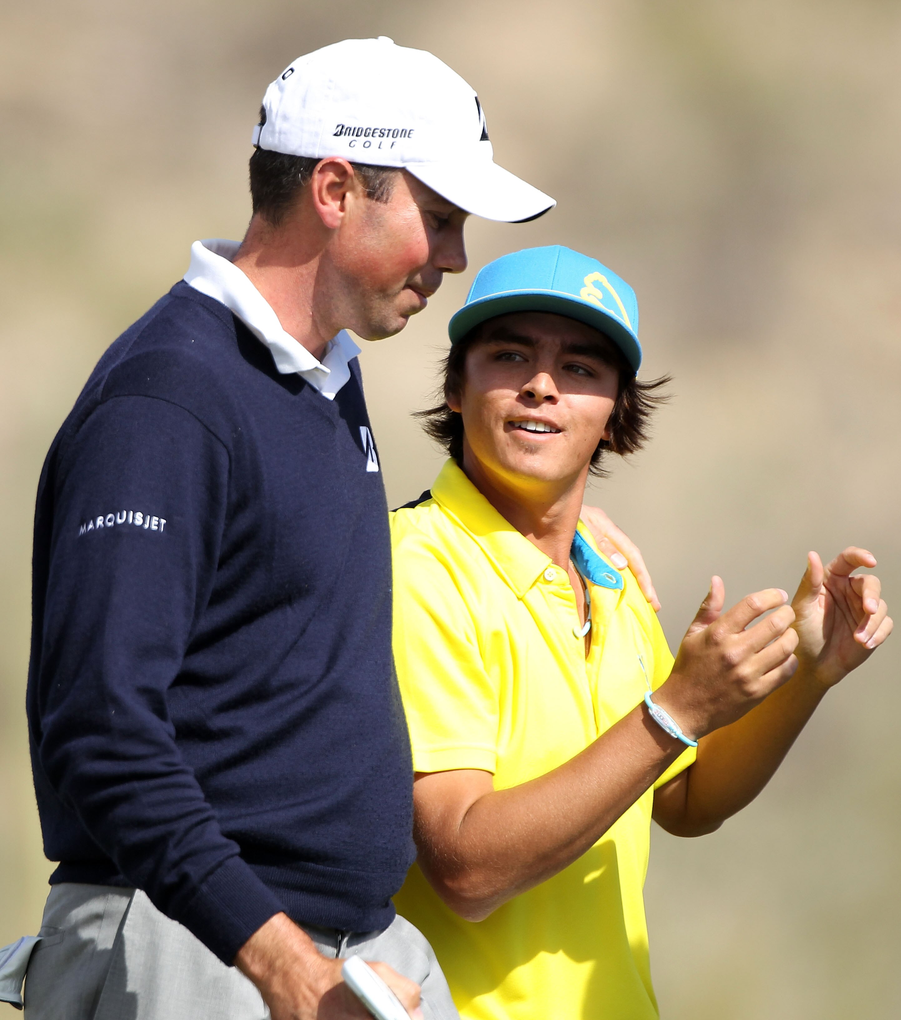 MARANA, AZ - FEBRUARY 25:  (L-R) Matt Kuchar talks with Rickie Fowler after defeating him on the 17th hole during the third round of the Accenture Match Play Championship at the Ritz-Carlton Golf Club on February 25, 2011 in Marana, Arizona.  (Photo by An