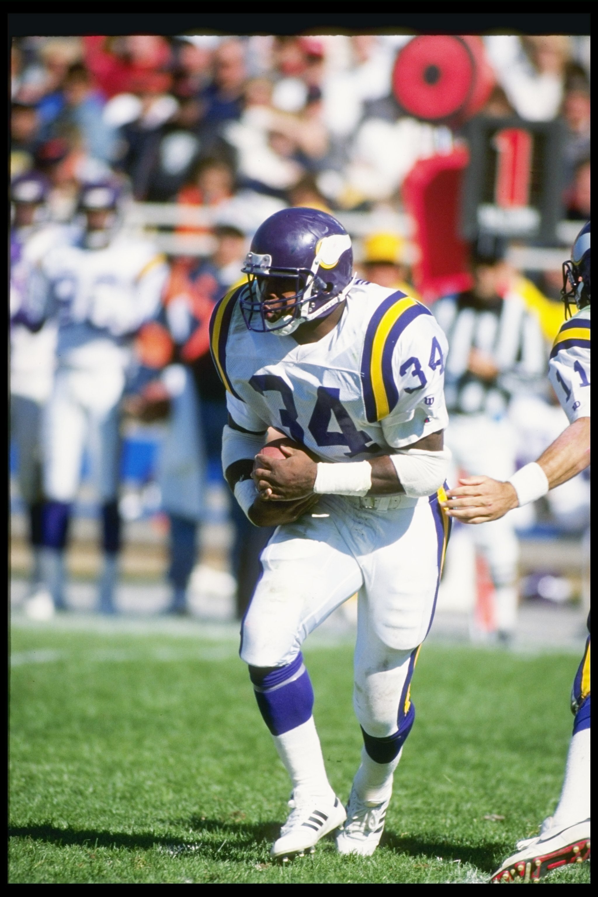 23 Sep 1990: Running back Herschel Walker of the Minnesota Vikings moves the ball during a game against the Chicago Bears at Soldier Field in Chicago, Illinois. The Bears won the game, 19-16.