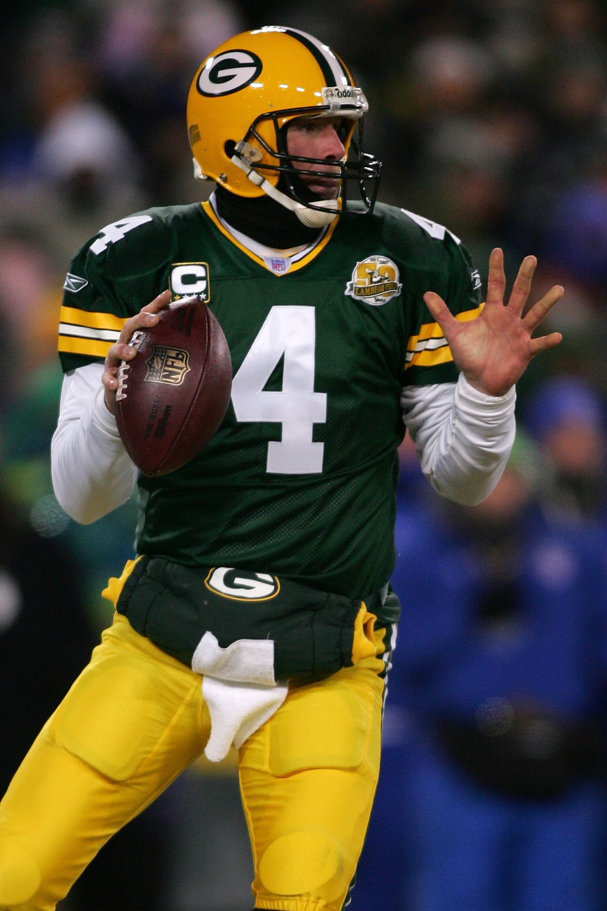 GREEN BAY, WI - JANUARY 20:  Quarterback Brett Favre #4 of the Green Bay Packers throws the ball during the NFC championship game against the New York Giants on January 20, 2008 at Lambeau Field in Green Bay, Wisconsin. The Giants defeated the Packers 23-